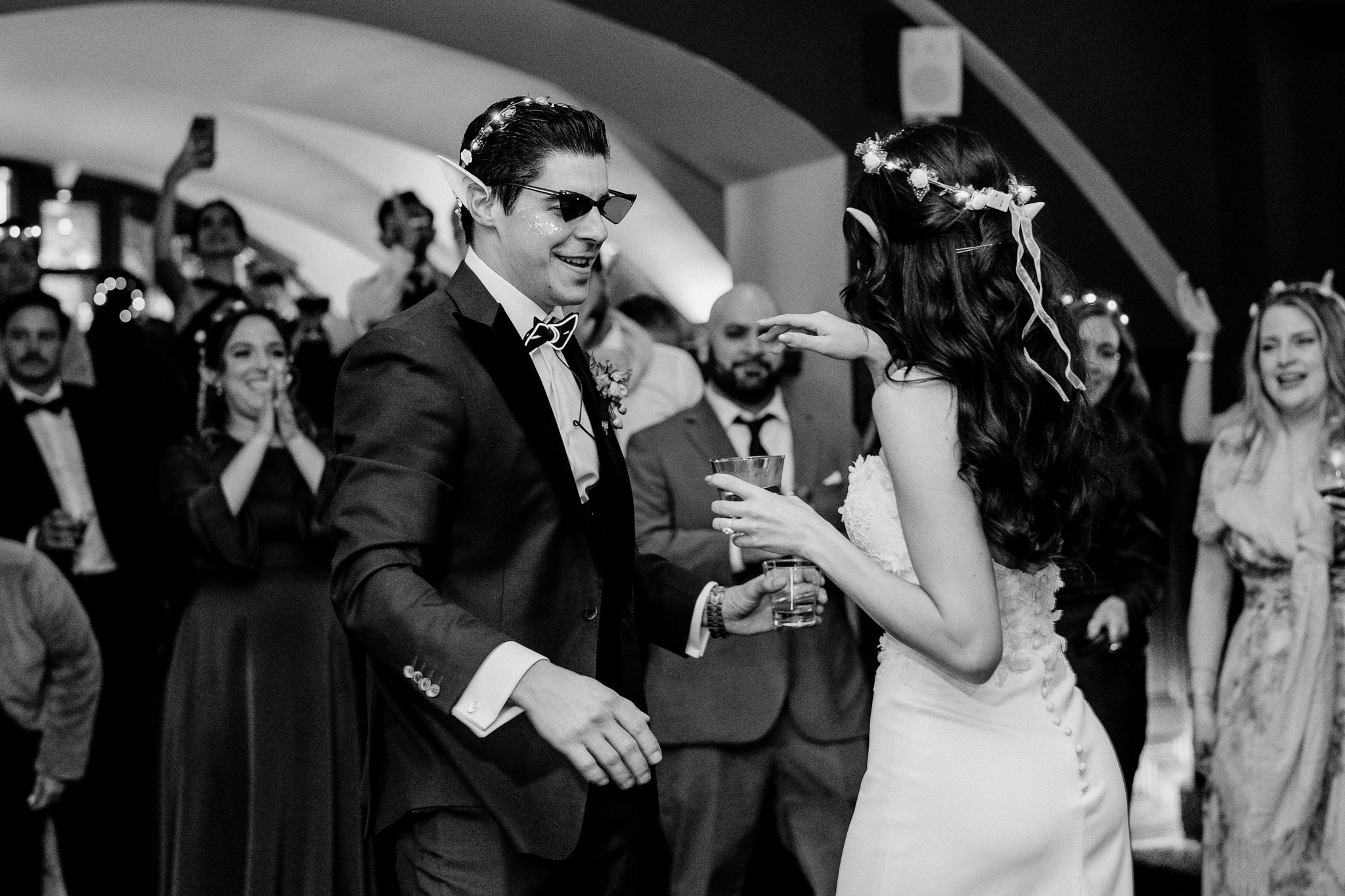 Candid black and white photo of wedding guests dancing at Markree Castle