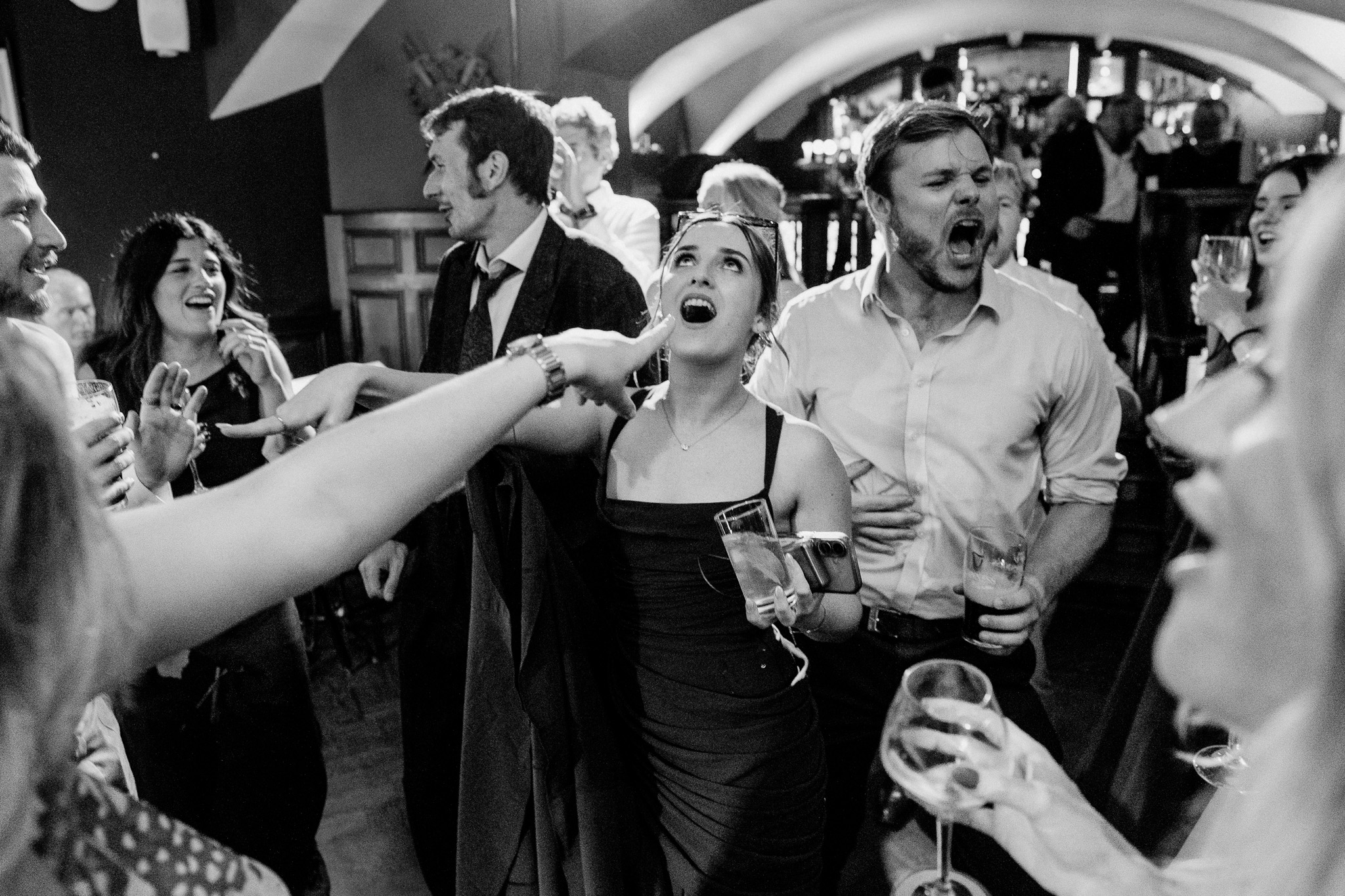 Wedding guests cheering and celebrating on the dance floor at Markree Castle