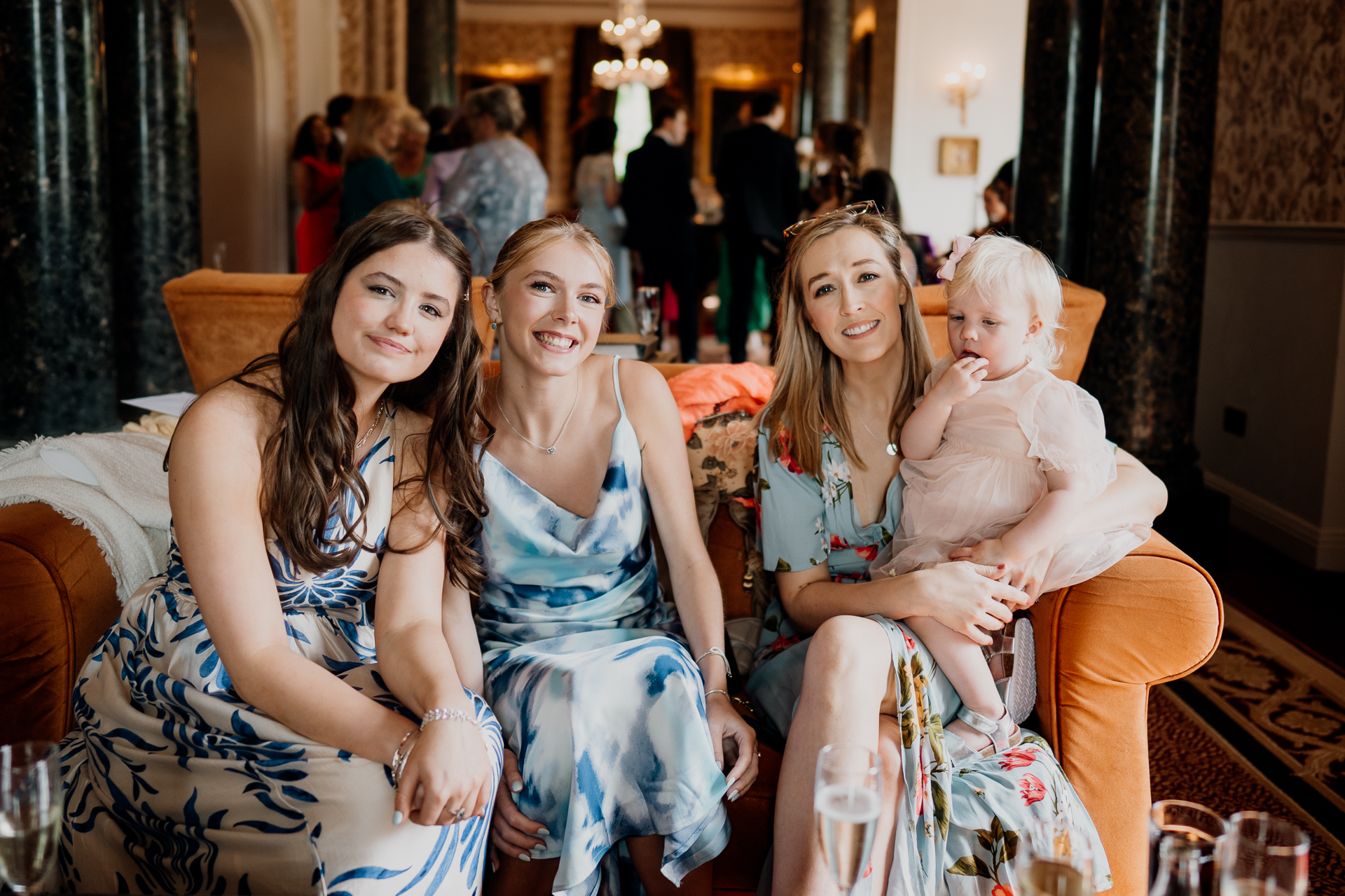 Wedding guests posing together with a baby at Markree Castle