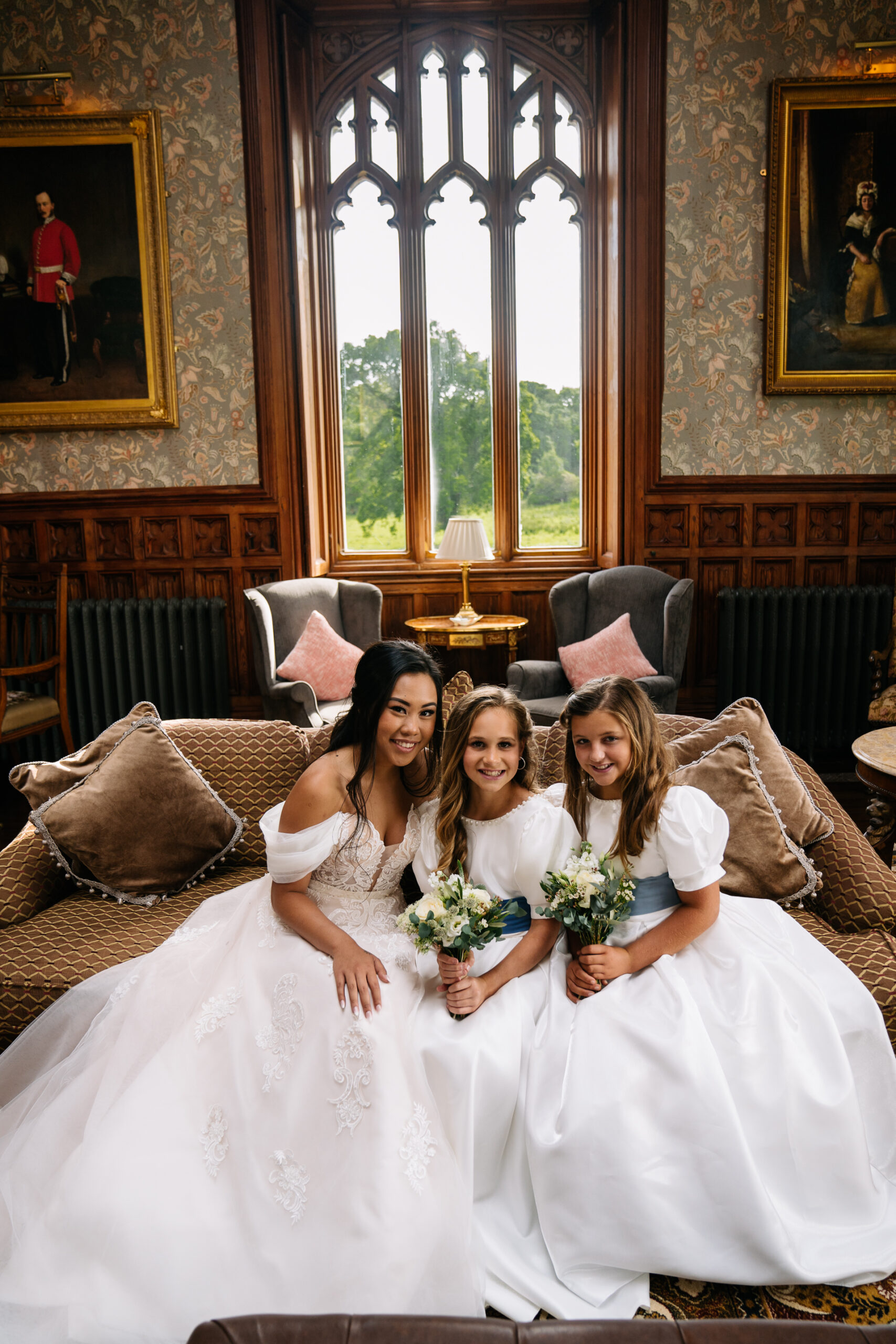 Wedding guests sitting together for a relaxed group photo at Markree Castle