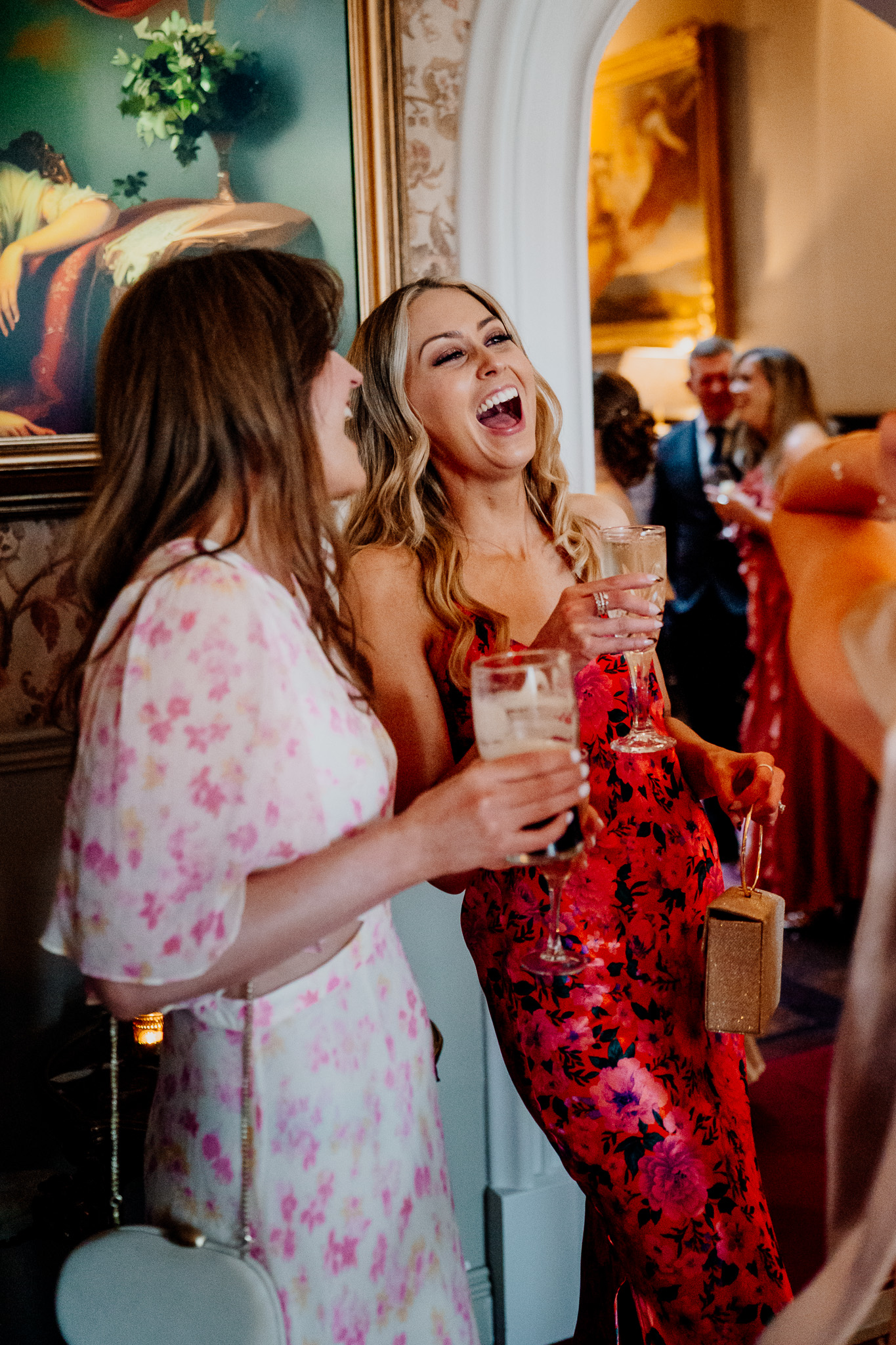 Wedding guests laughing together during a reception at Markree Castle