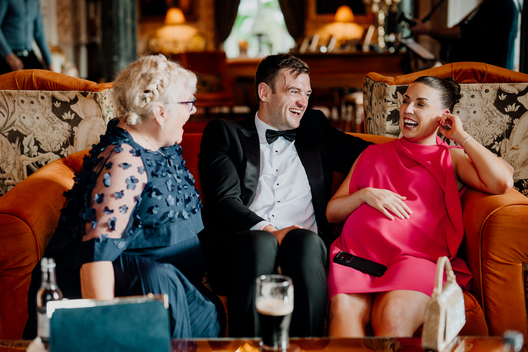 Wedding guests laughing together during a Markree Castle reception
