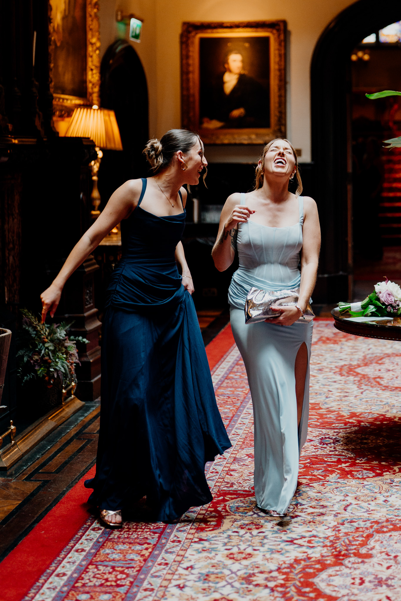 Two wedding guests laughing together during a Markree Castle reception