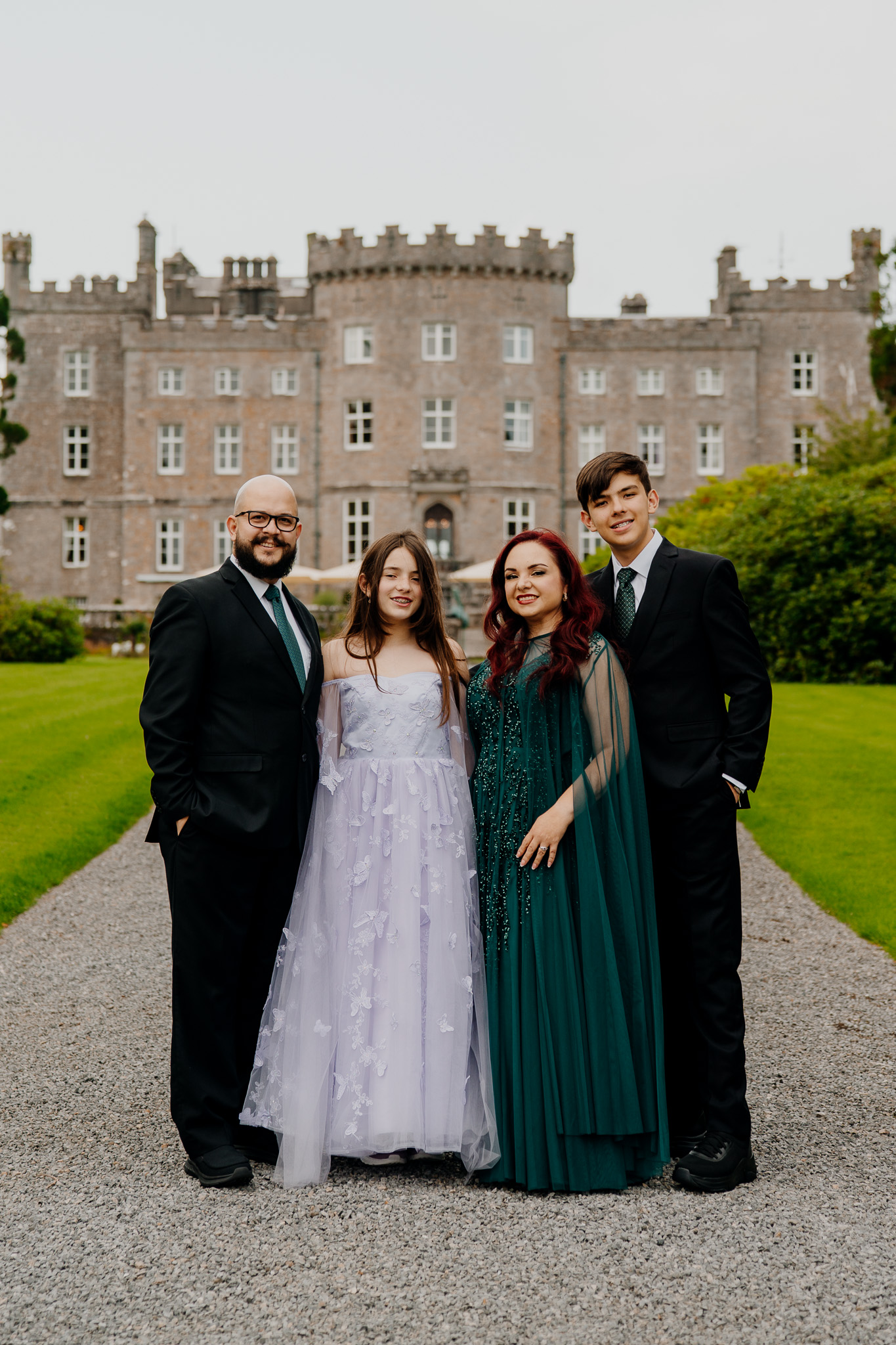 Wedding guests posing together with Markree Castle in the background