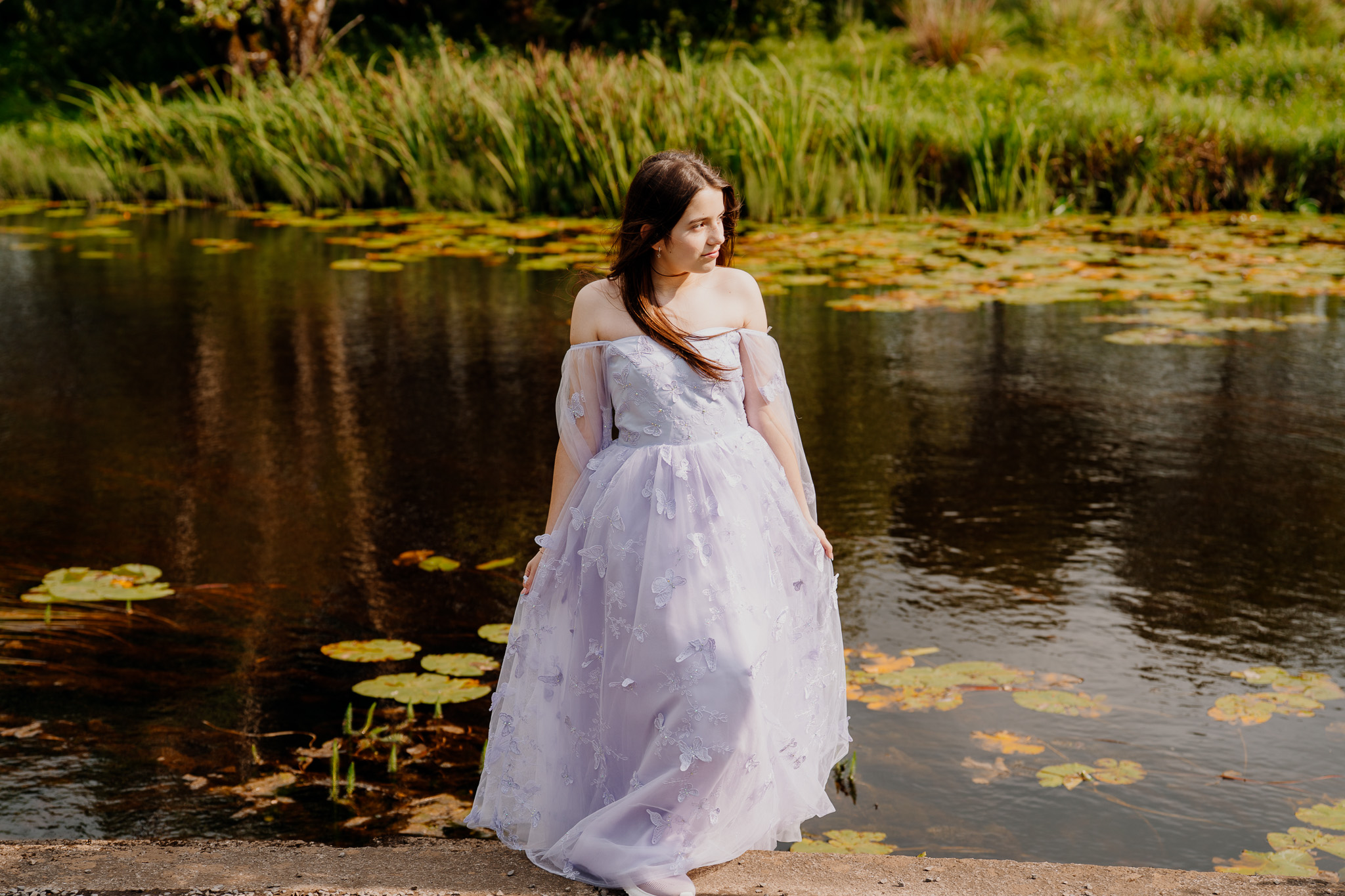 Girl by the river during a wedding celebration at Markree Castle
