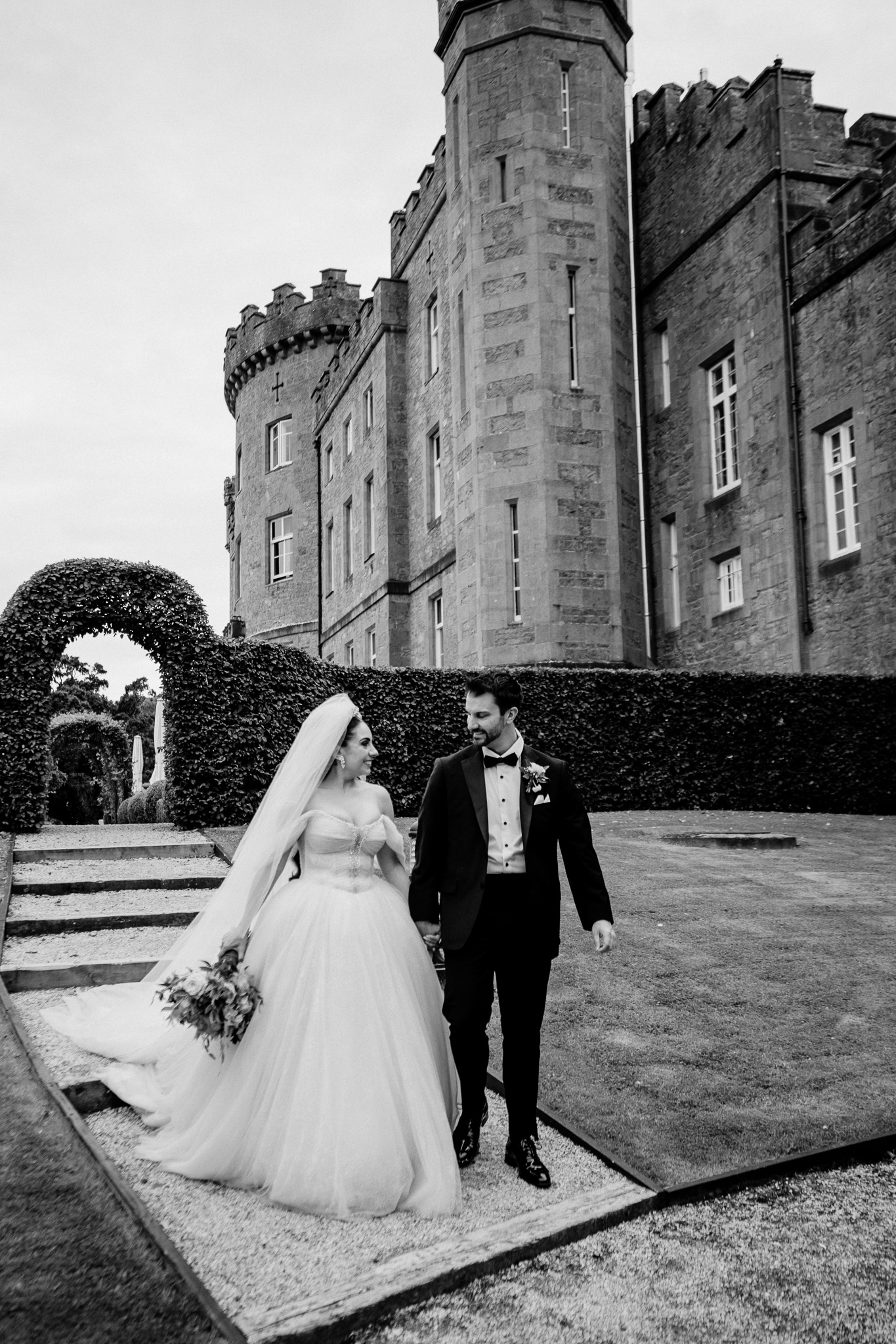 Bride and groom wedding portrait in the gardens with Markree Castle in the background