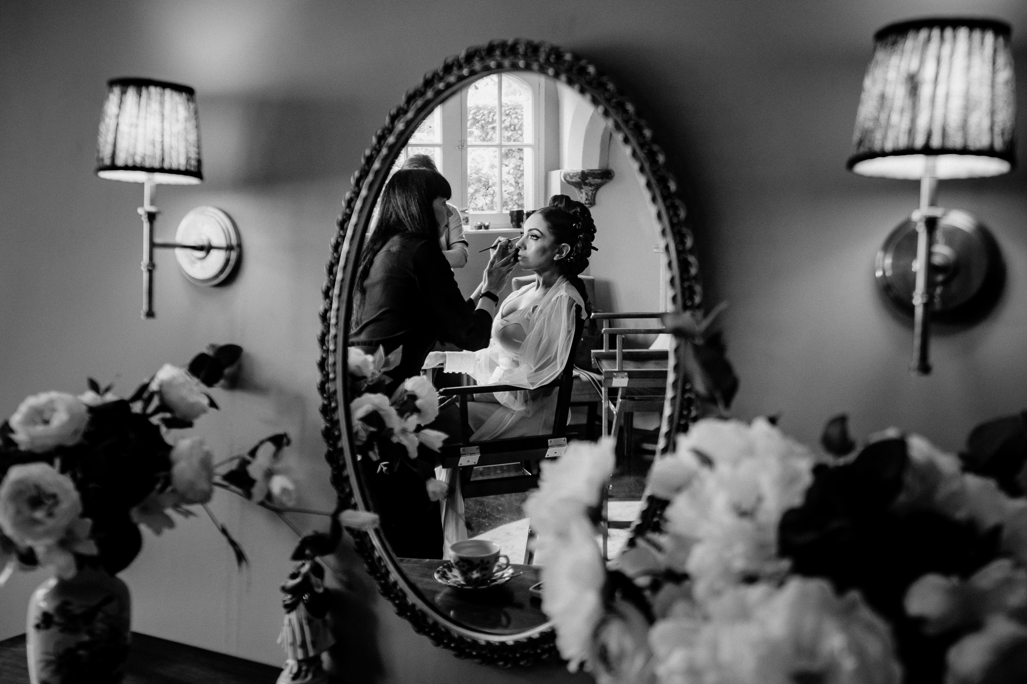 Bride getting ready in front of a mirror at Markree Castle