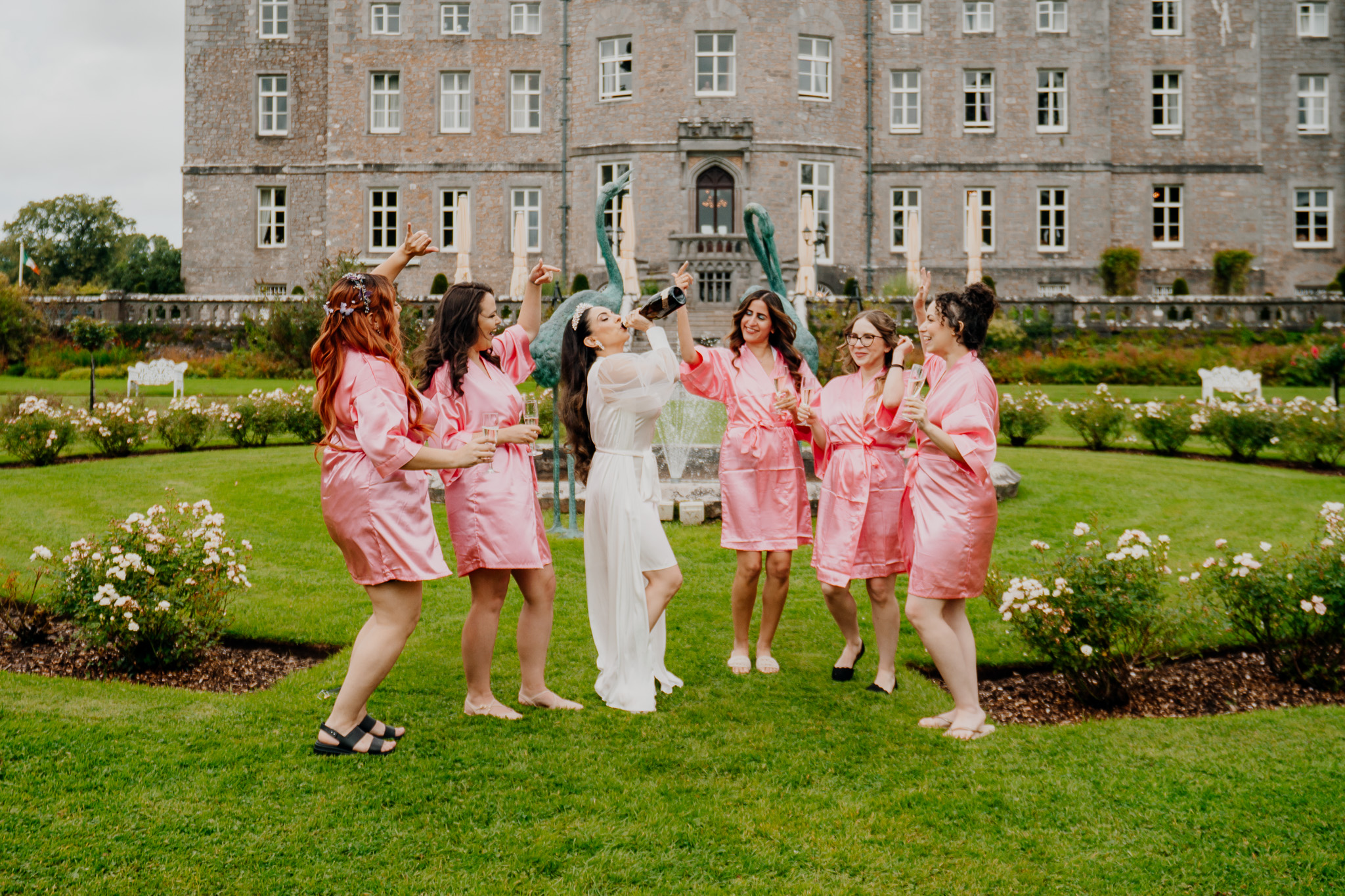 Bridesmaids celebrating outside Markree Castle on the wedding morning