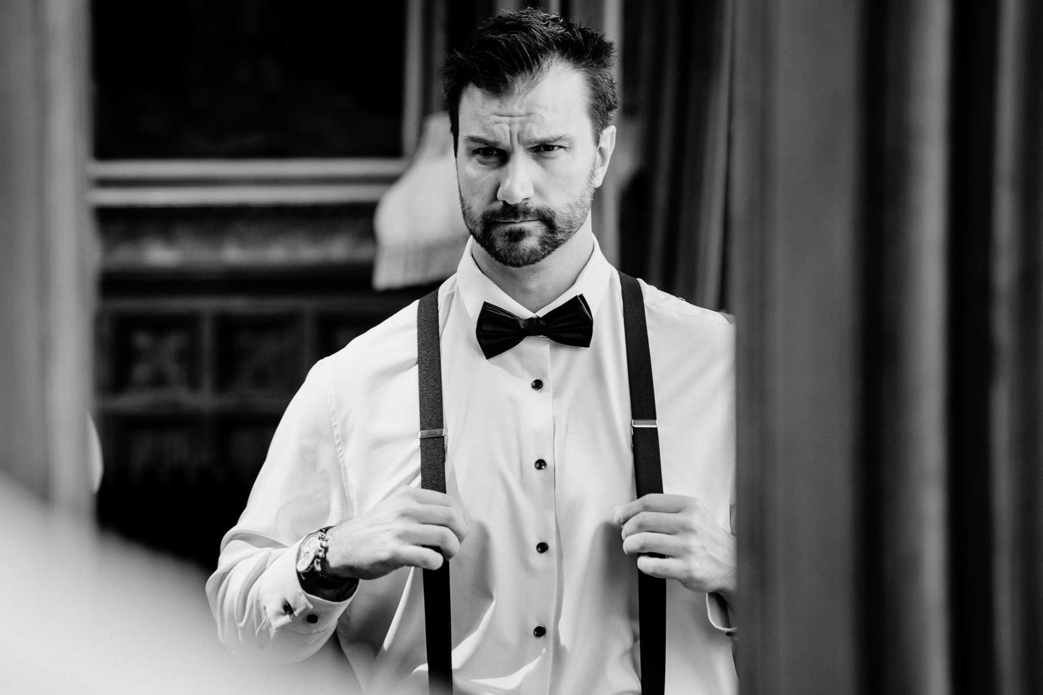 Black and white portrait of the groom getting ready at Markree Castle