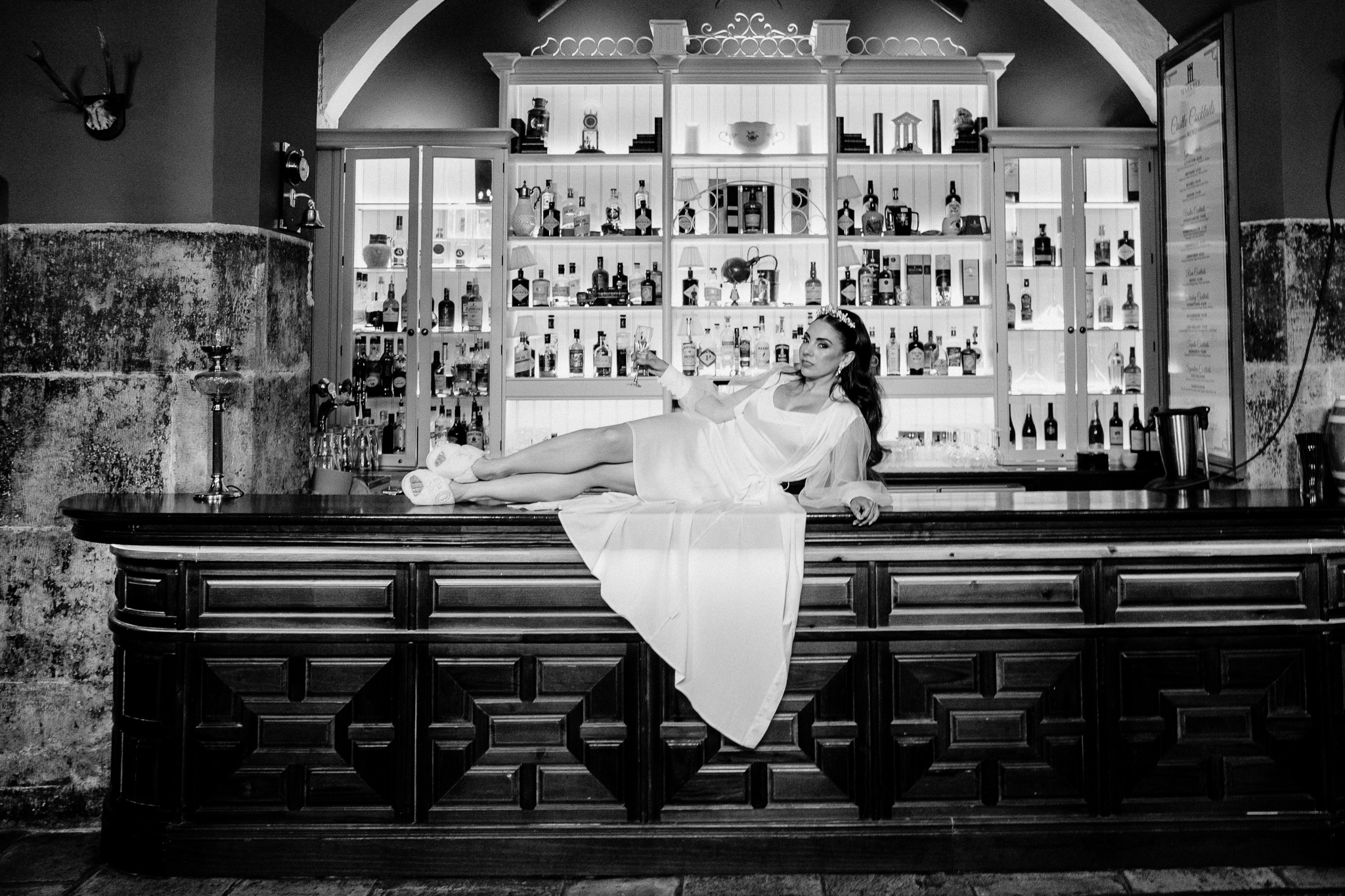 Bride enjoying a drink in the Gin Bar during her Markree Castle wedding preparations
