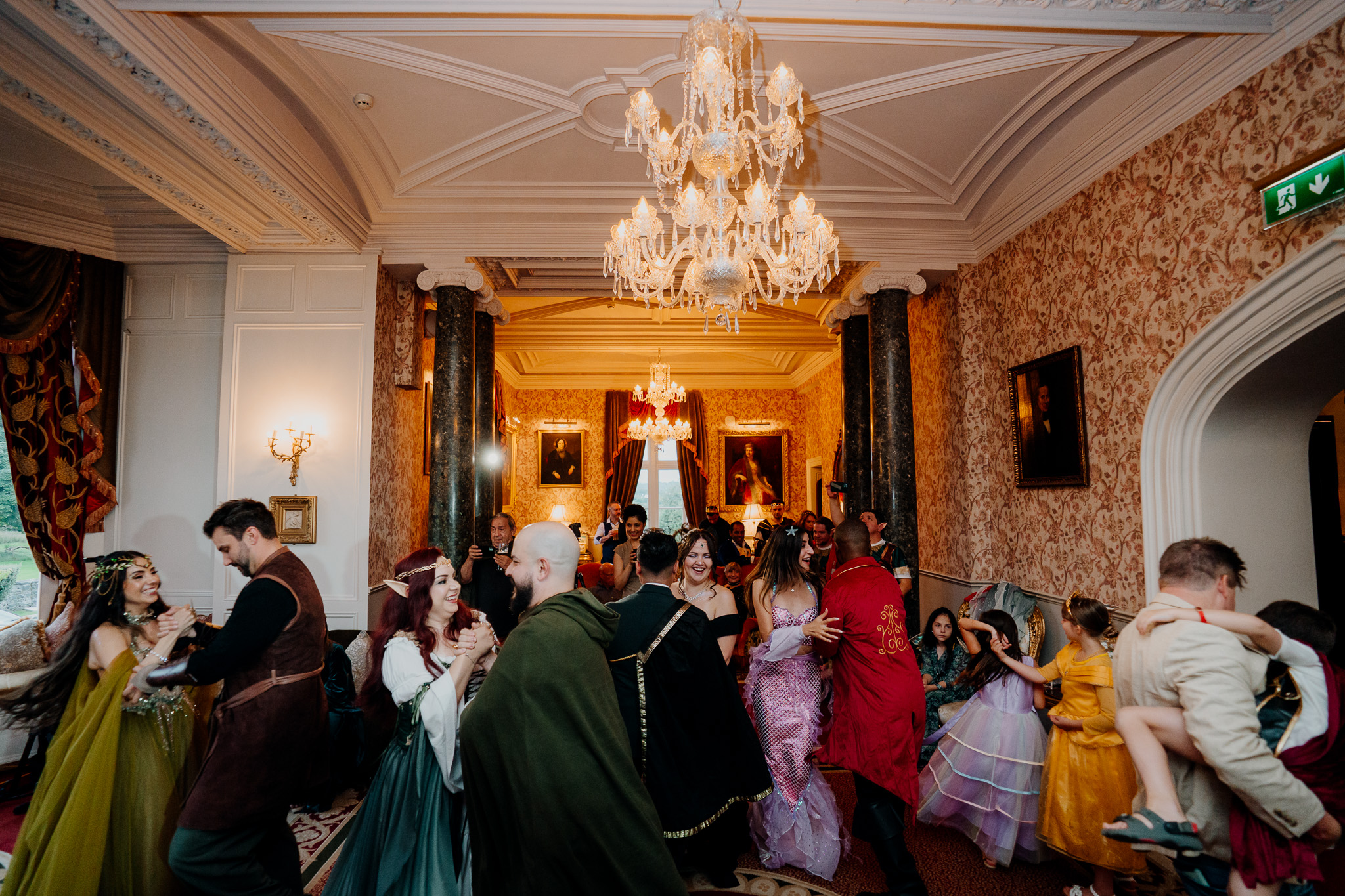 Wedding guests at a rehearsal dinner inside Markree Castle