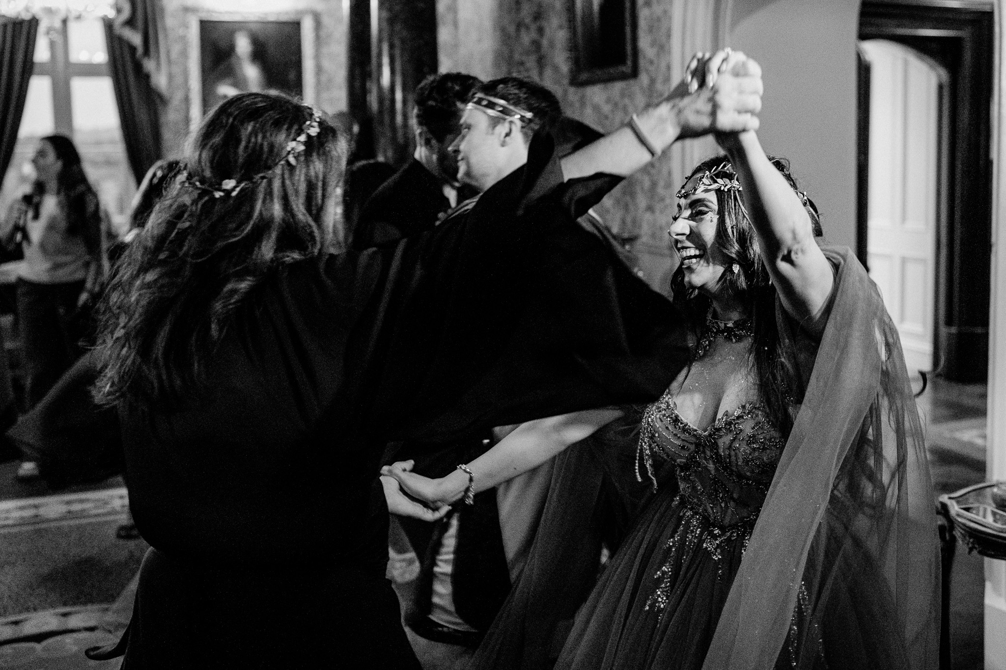 Candid moment between guests at a Markree Castle wedding rehearsal dinner
