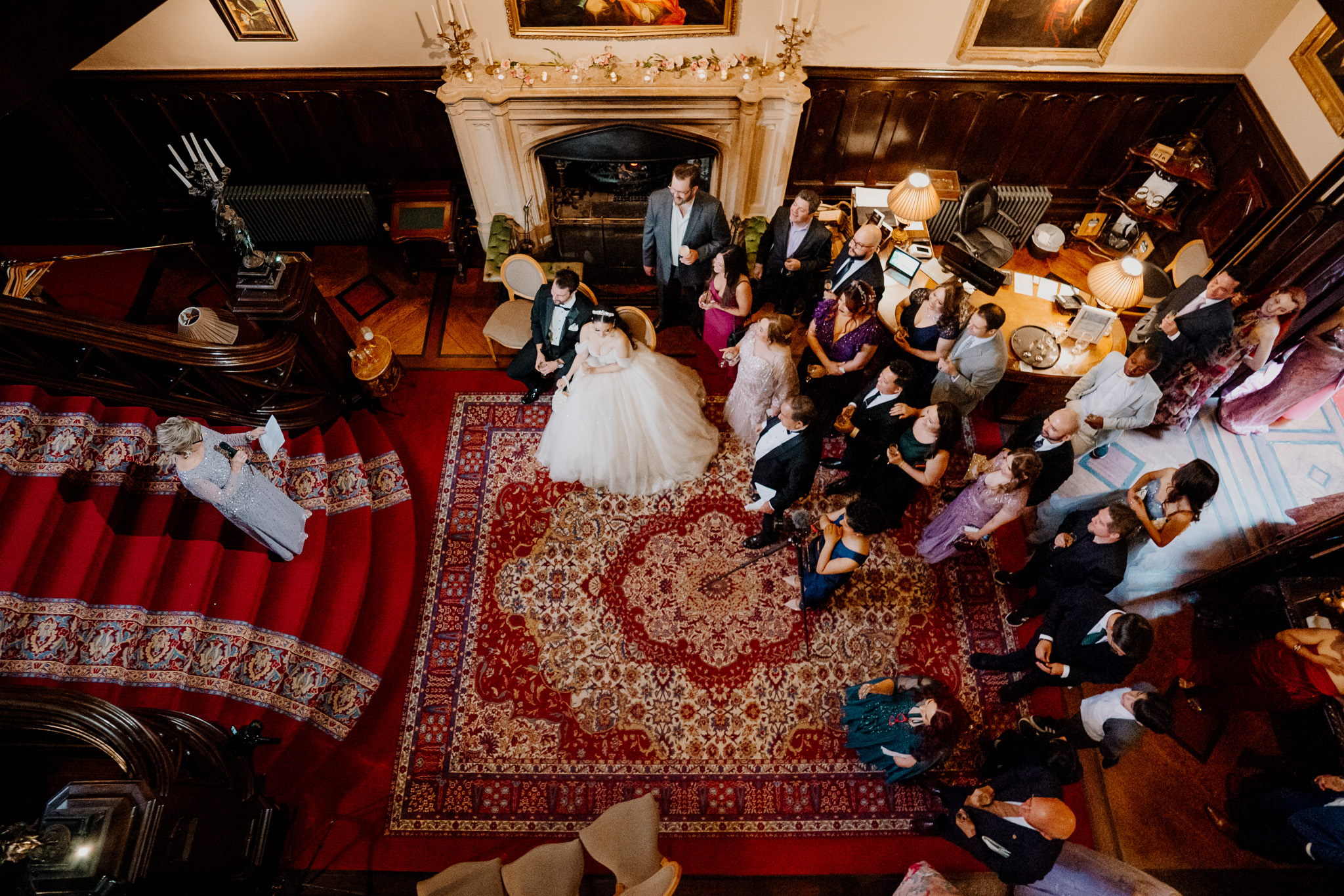 Wedding speeches with guests gathered around the grand staircase at Markree Castle