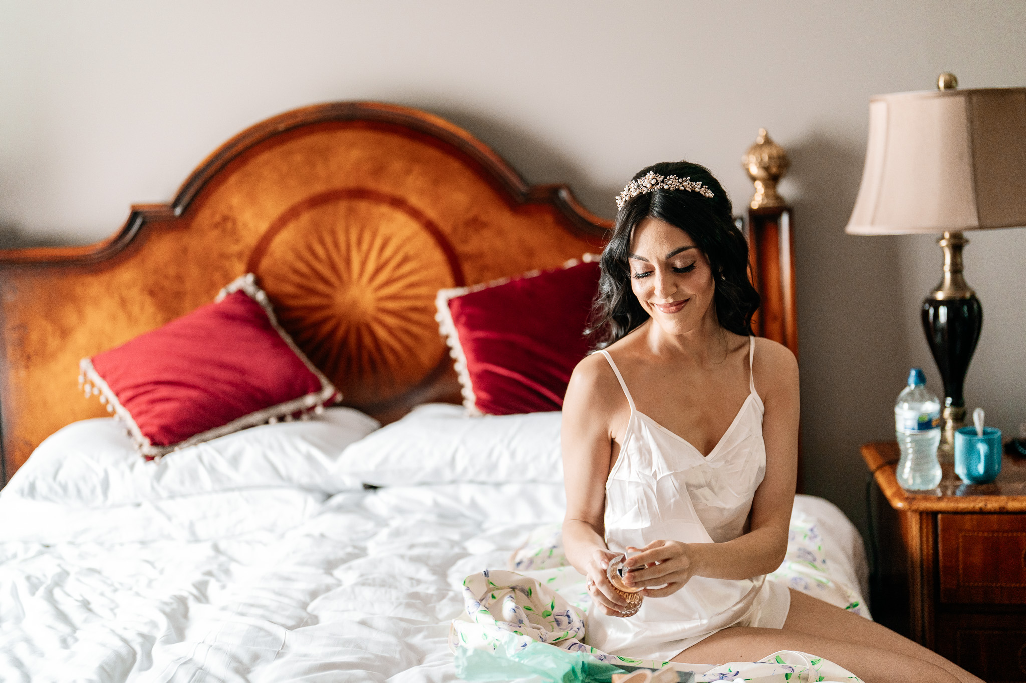 Bride relaxing on the bed in the Bridal Suite at Markree Castle