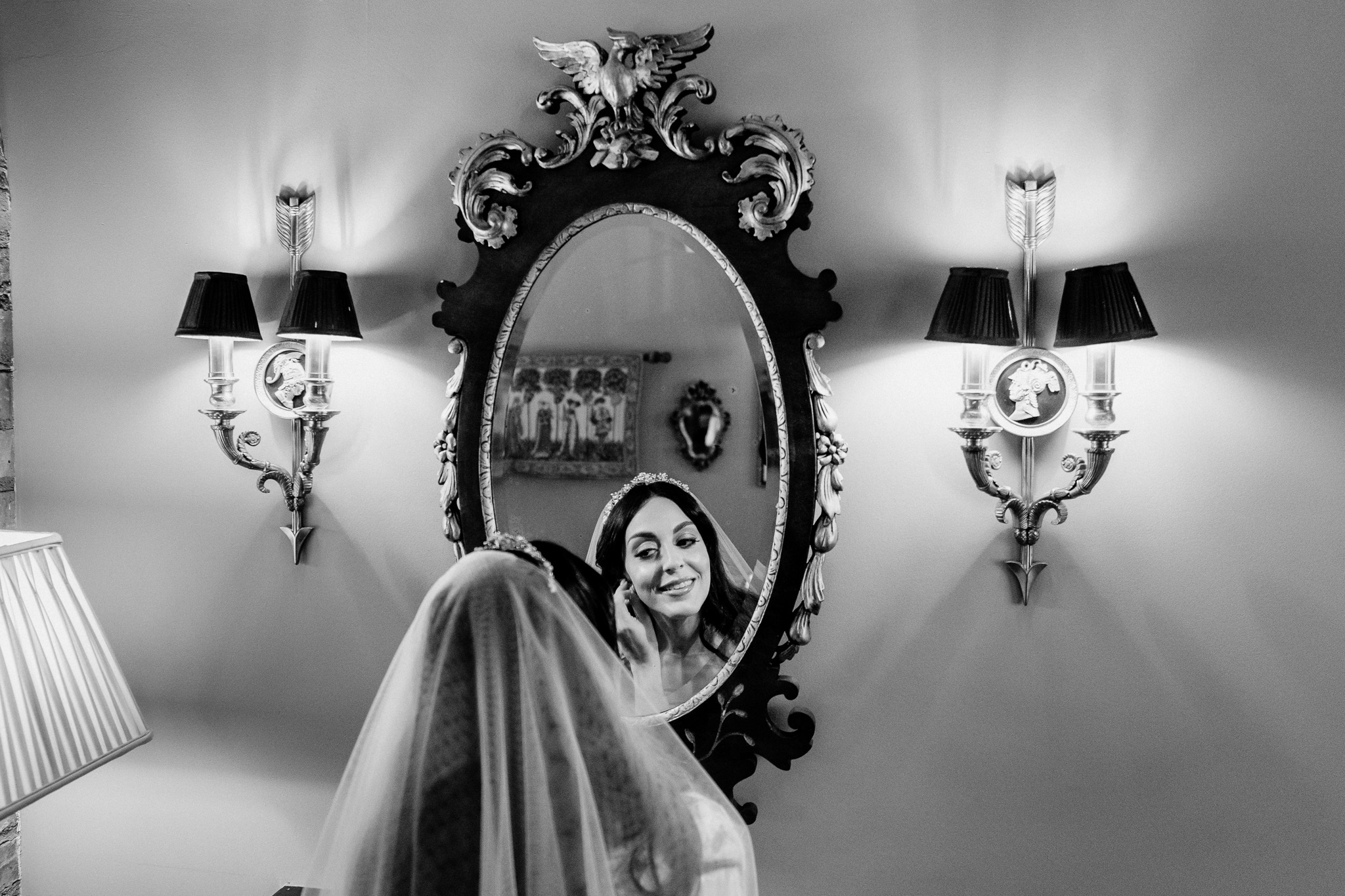 Bride reflected in an ornate mirror in the Bridal Suite at Markree Castle