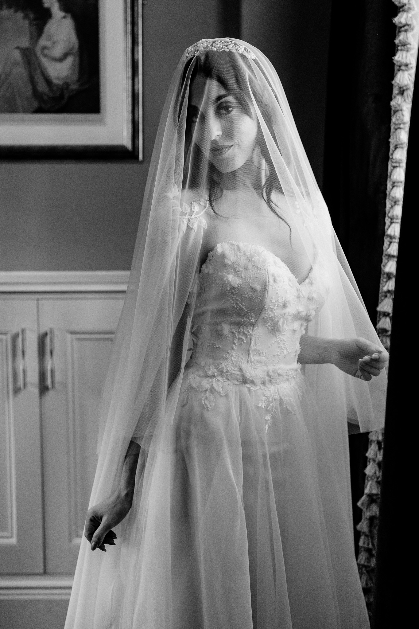 Bride standing by the window during preparations at Markree Castle