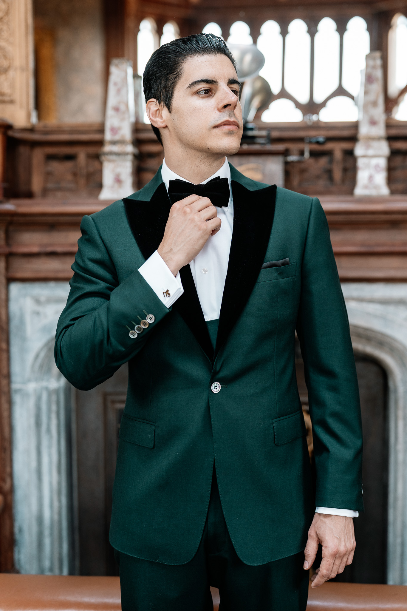 Groom adjusting his bow tie during wedding preparations at Markree Castle