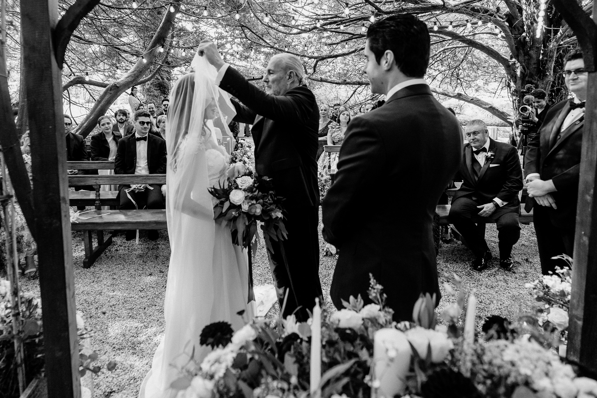 Bride and groom exchanging vows during their woodland ceremony at Markree Castle
