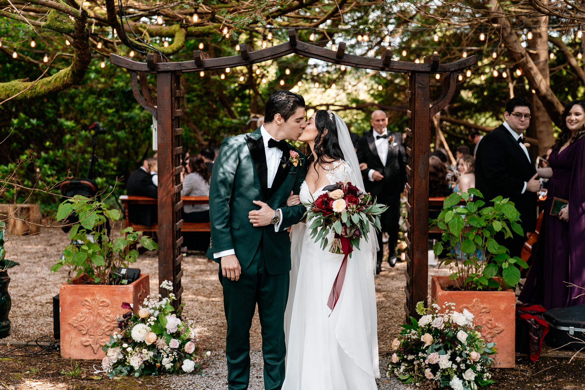 Newlyweds walking back down the aisle after their Markree Castle woodland ceremony