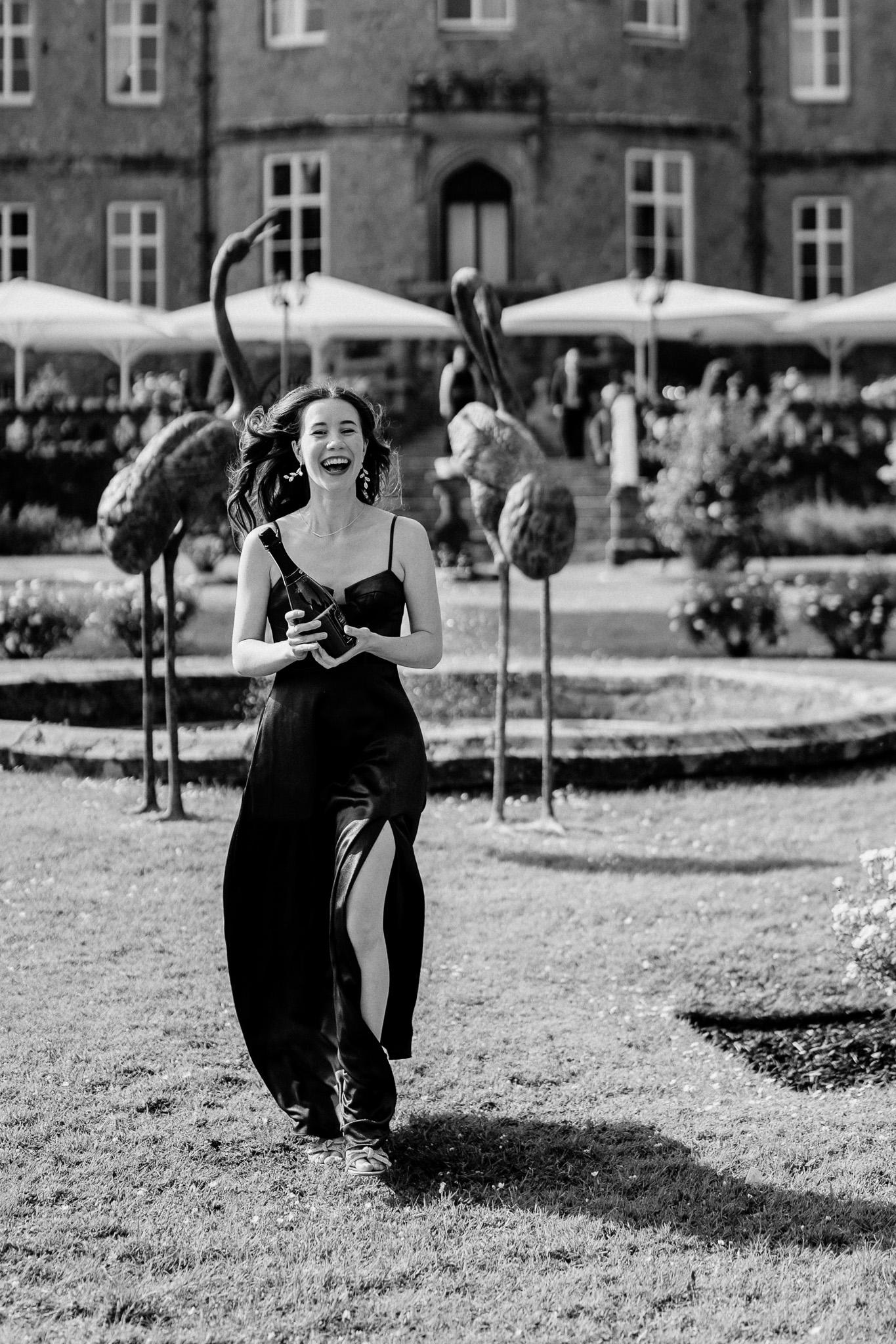 Wedding guest bringing champagne to the newlyweds after their Markree Castle ceremony