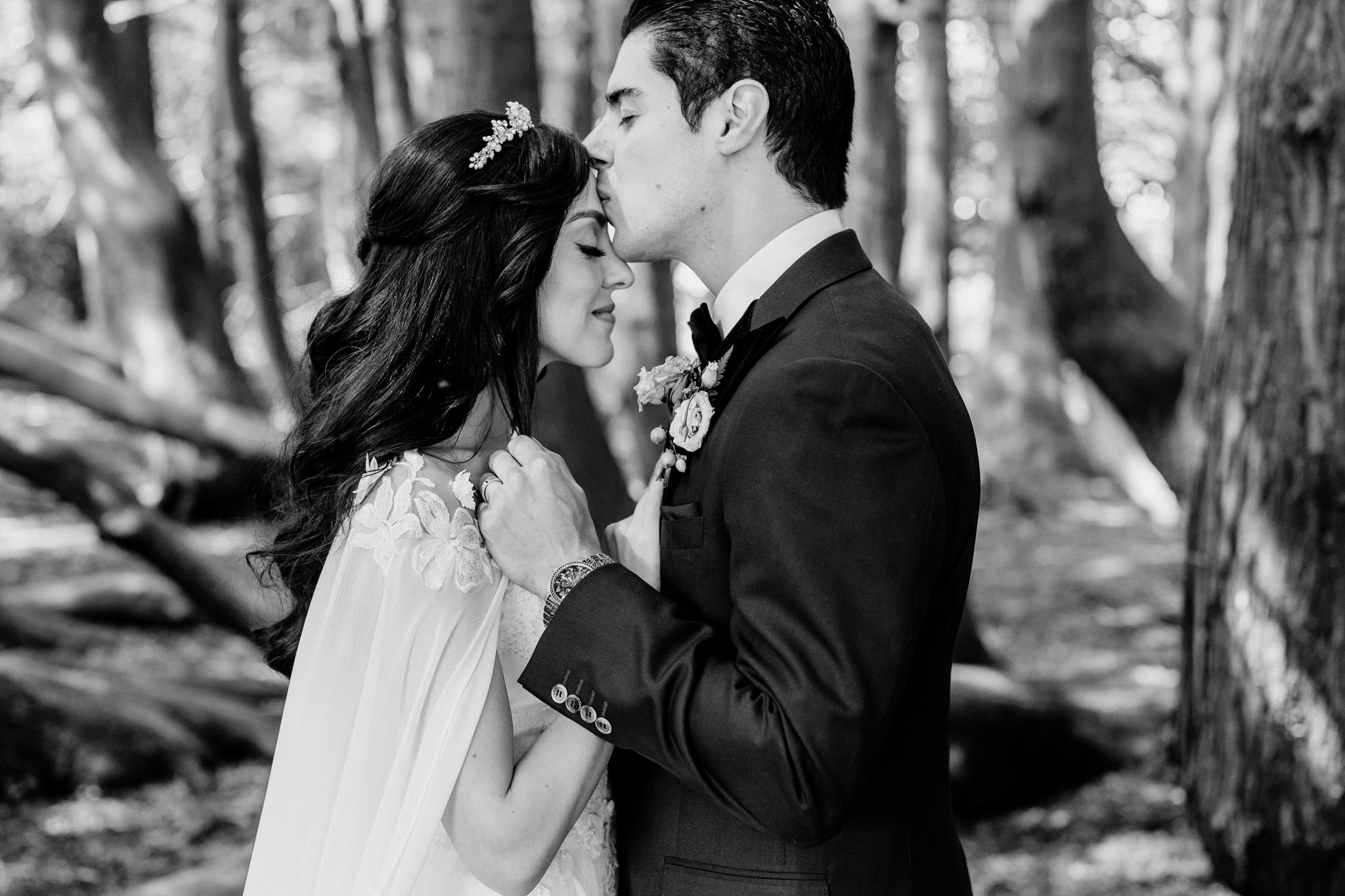 Bride and groom embracing among the trees during their Markree Castle wedding