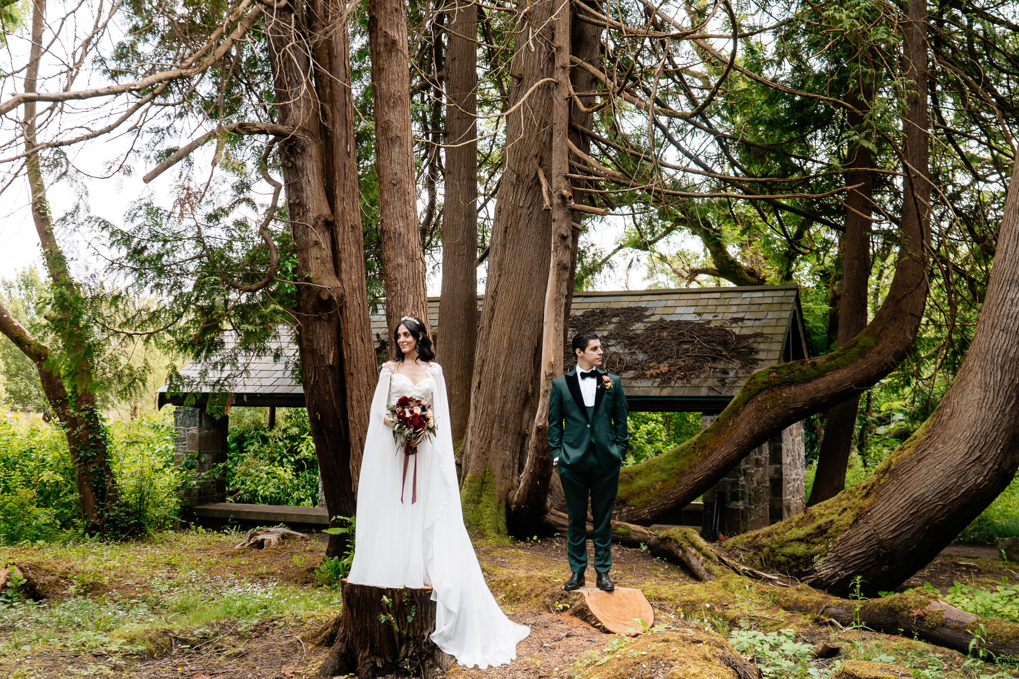 Bride and groom standing among the trees near the Boathouse at Markree Castle
