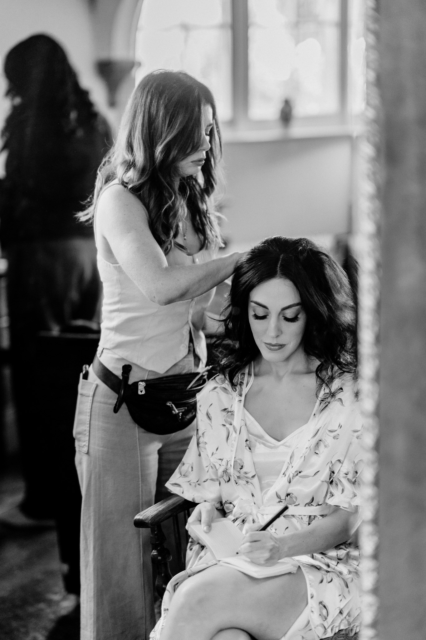 Bride having her hair styled during wedding preparations at Markree Castle