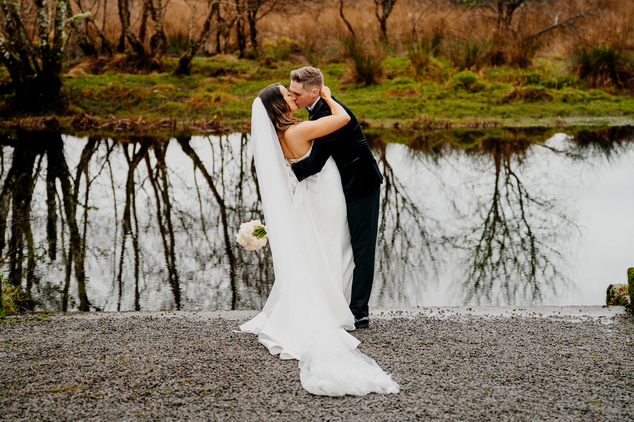 Bride and groom beside the river at Markree Castle