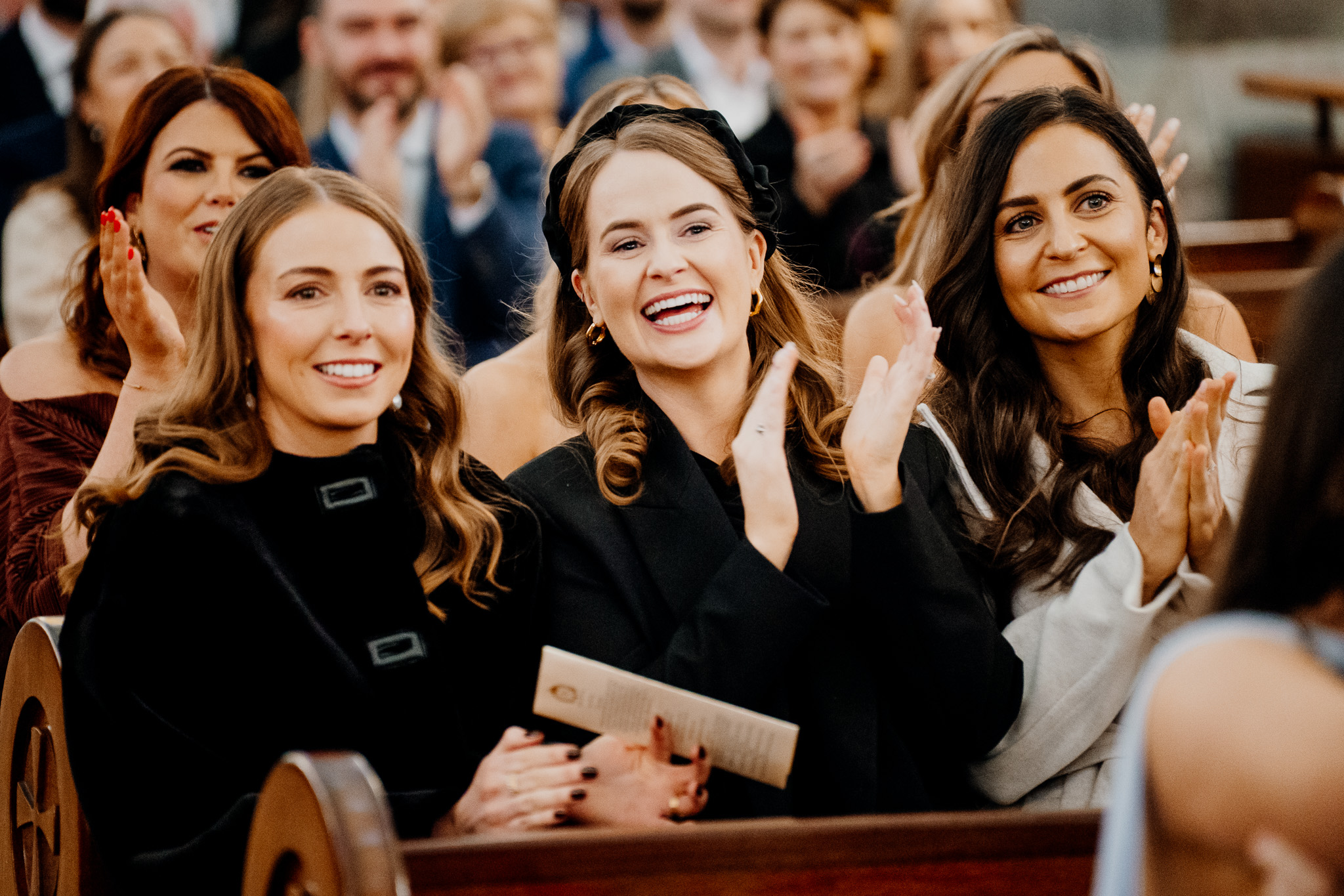 Wedding guests reacting during a ceremony at Sligo Cathedral