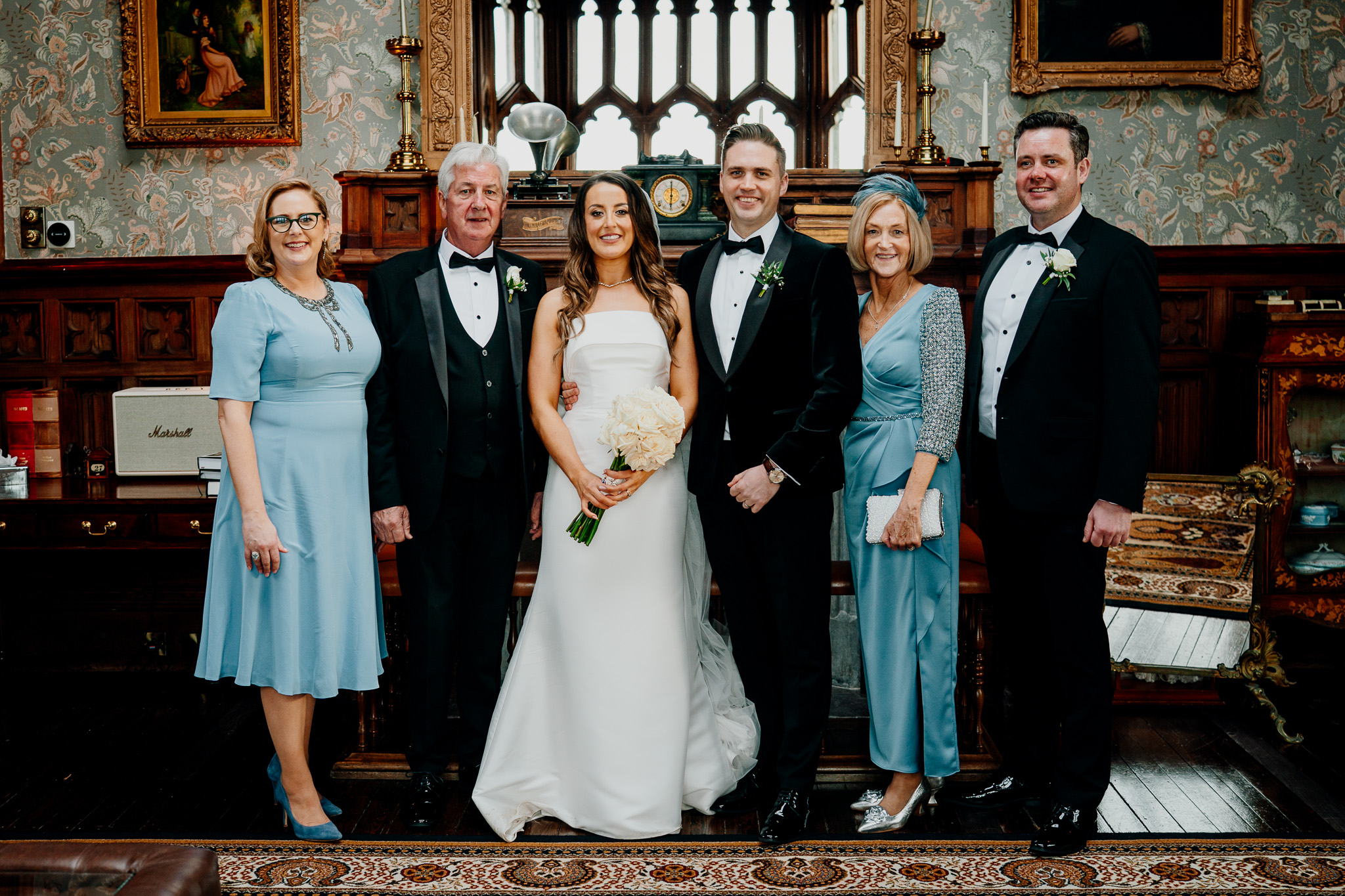 Bride and groom with family in the Billiard Room at Markree Castle