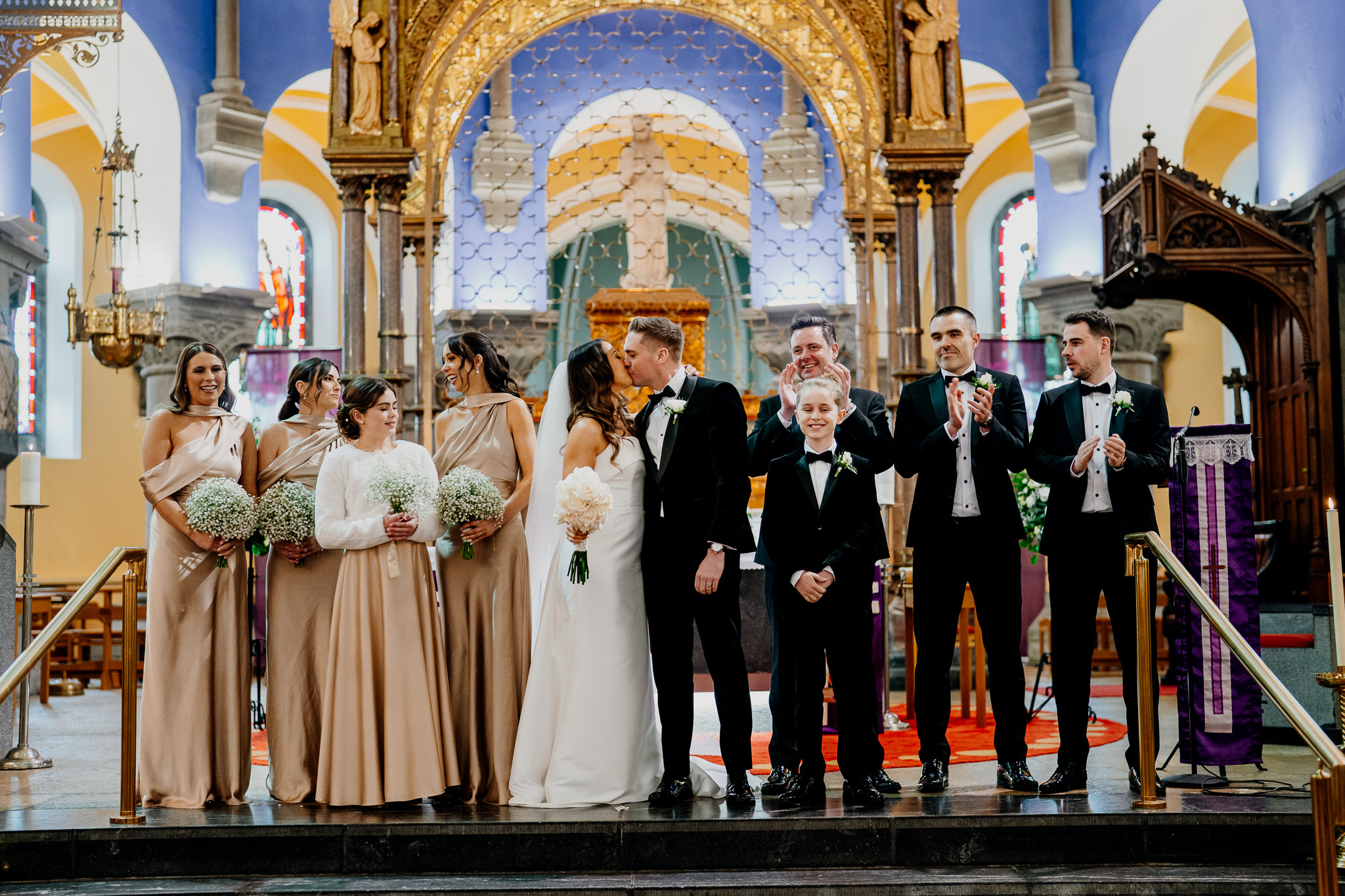 Bride and groom with family at the altar in Sligo Cathedral