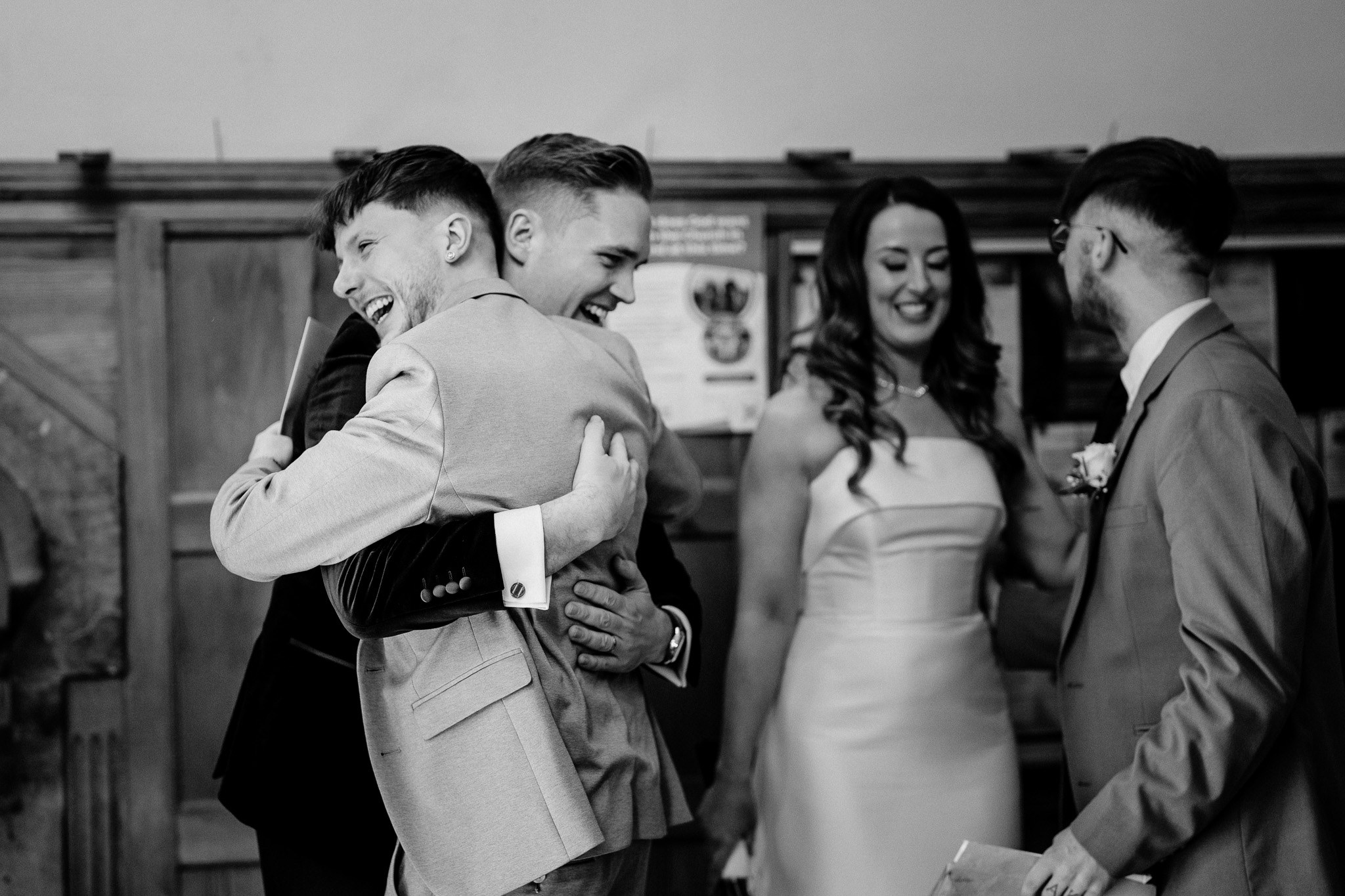 Emotional family hug during a wedding ceremony in Sligo