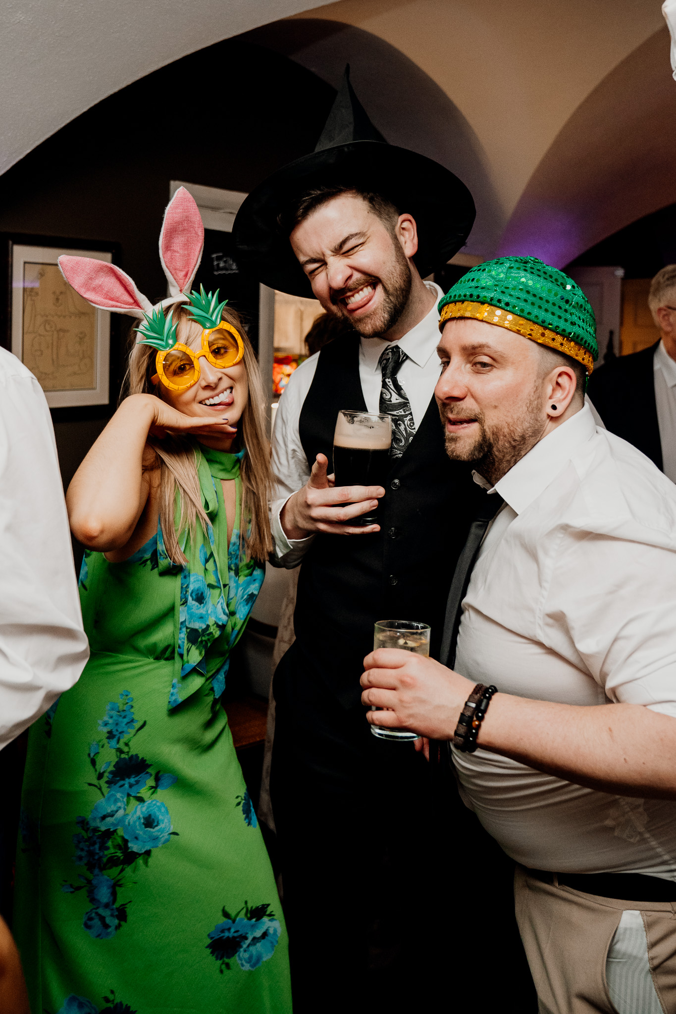 Wedding guests in colourful party hats on the dance floor at Markree Castle