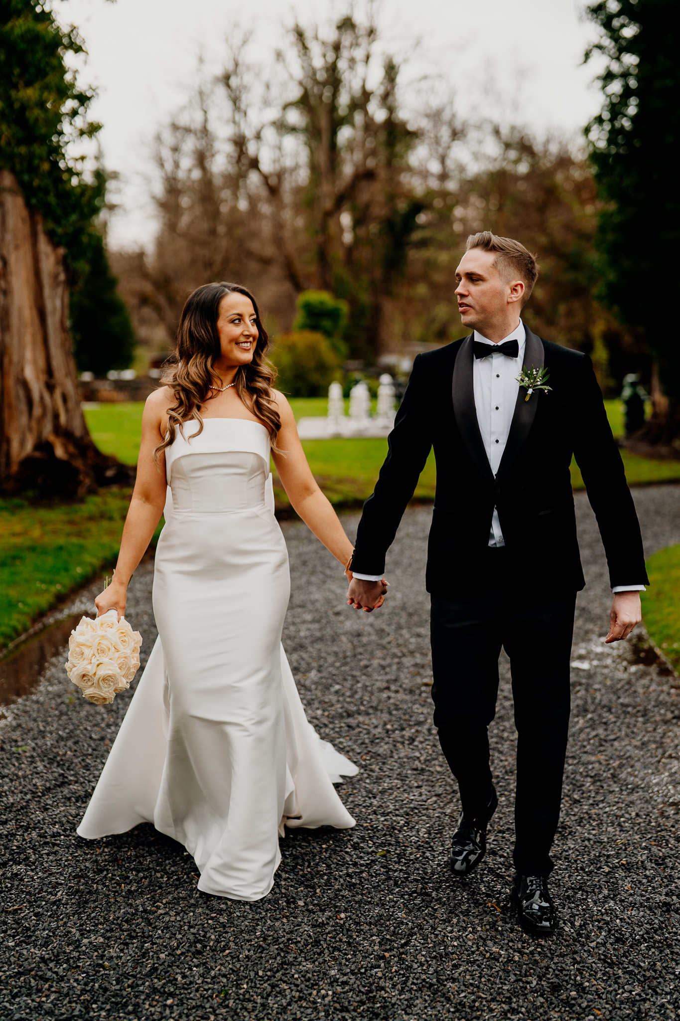 Bride and groom walking together in the gardens at Markree Castle