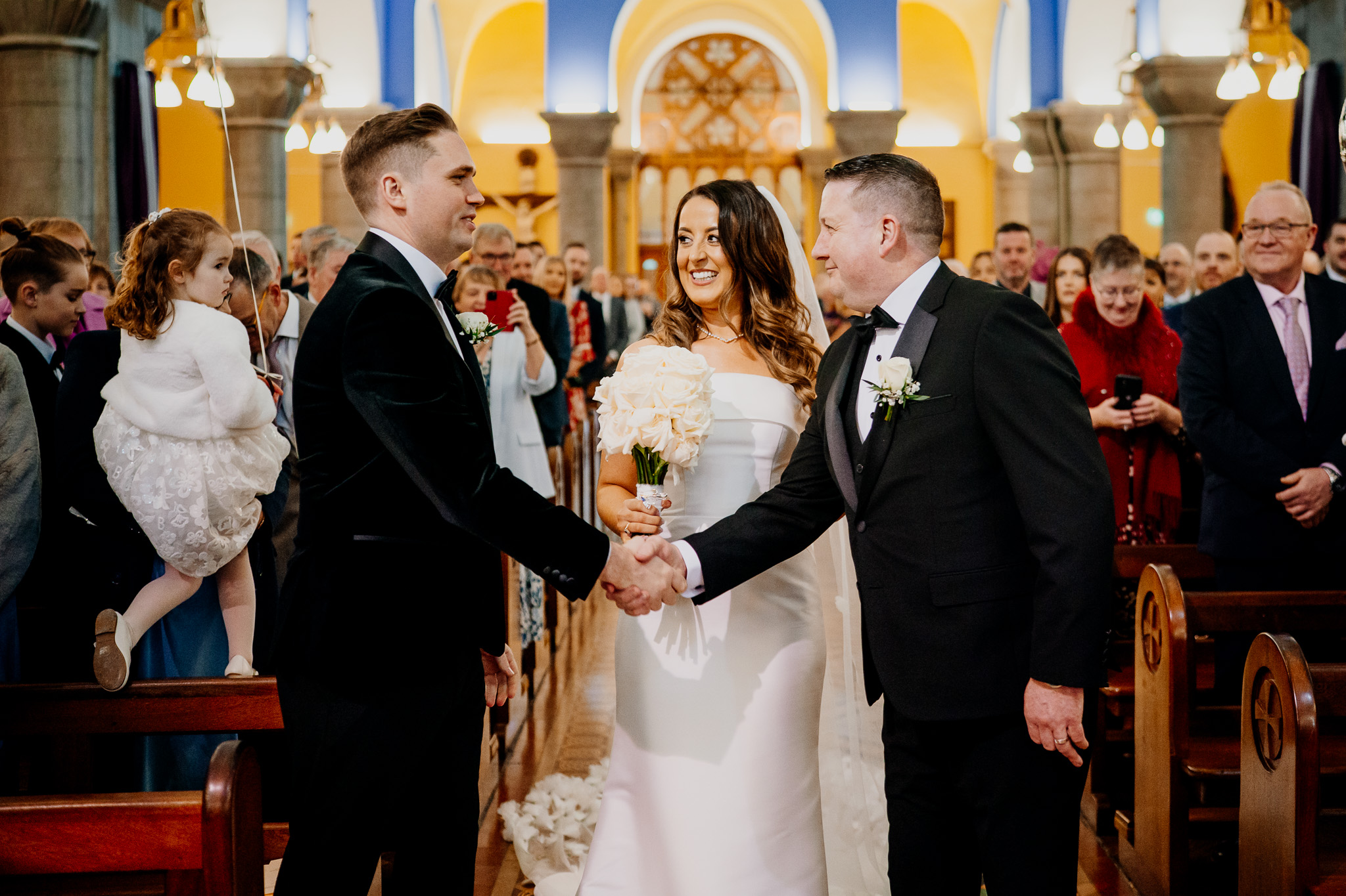 Groom sharing a moment before his wedding ceremony in Sligo Cathedral