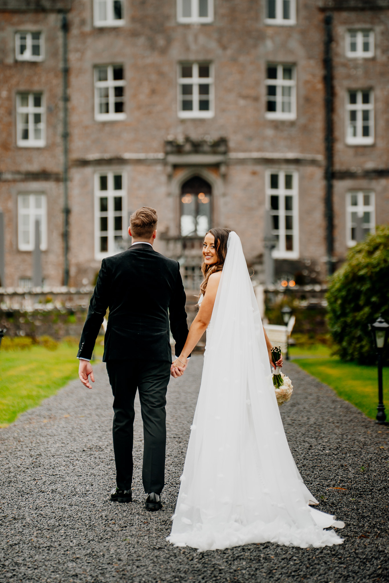 Bride and groom in the gardens with Markree Castle in the background