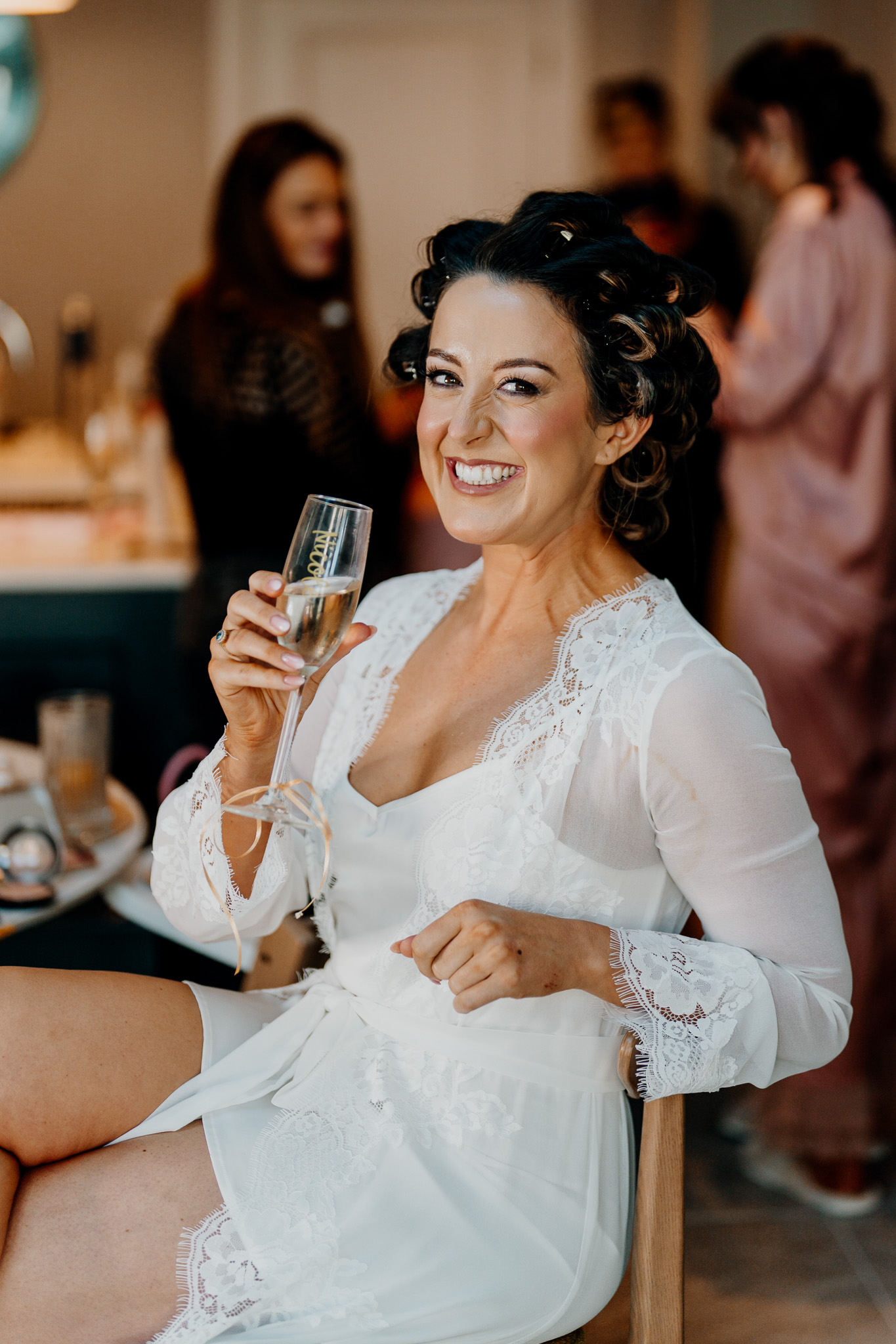 Bride enjoying a drink during wedding morning preparations in Sligo