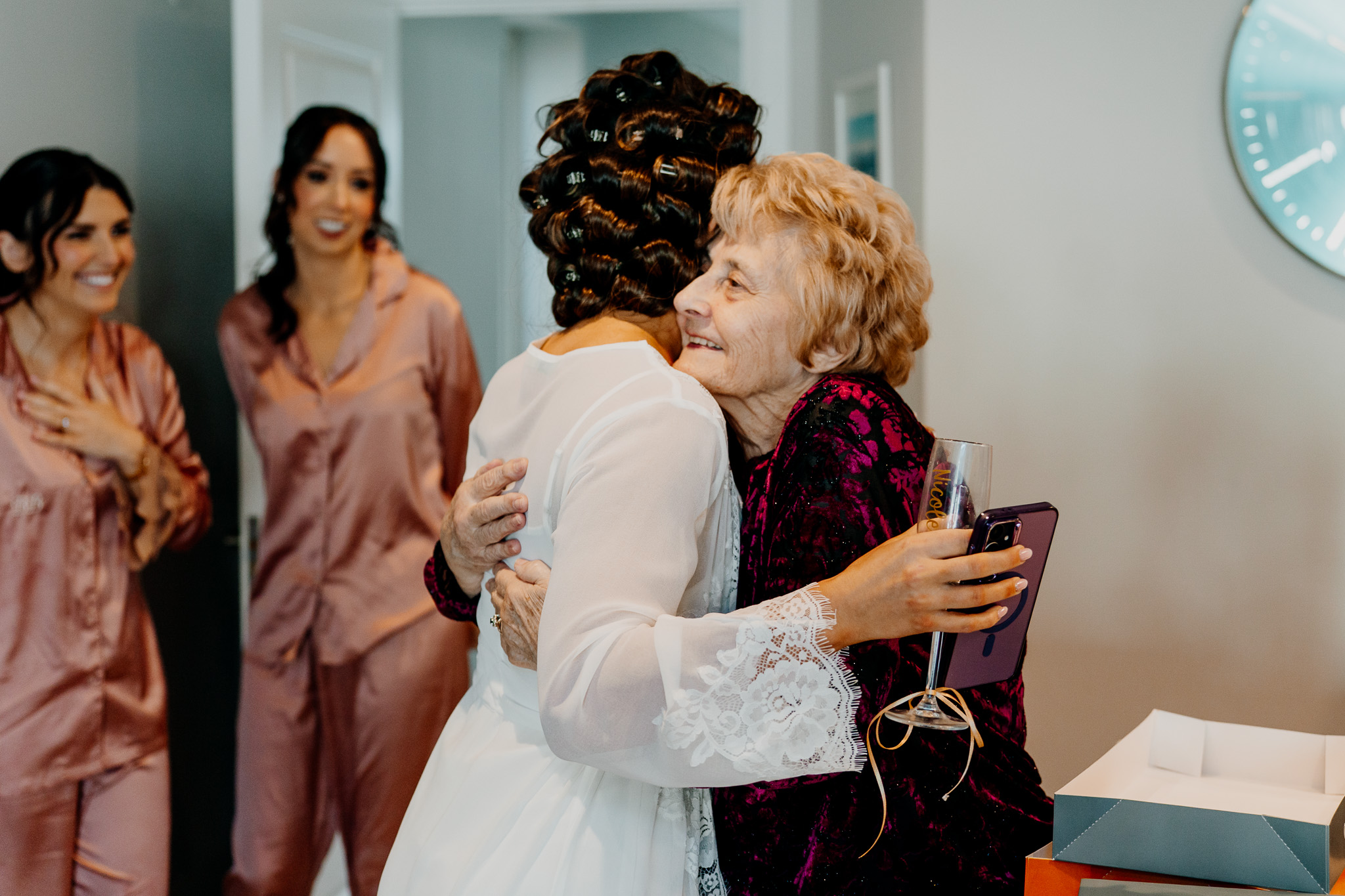Bride sharing a moment with a family member during wedding preparations