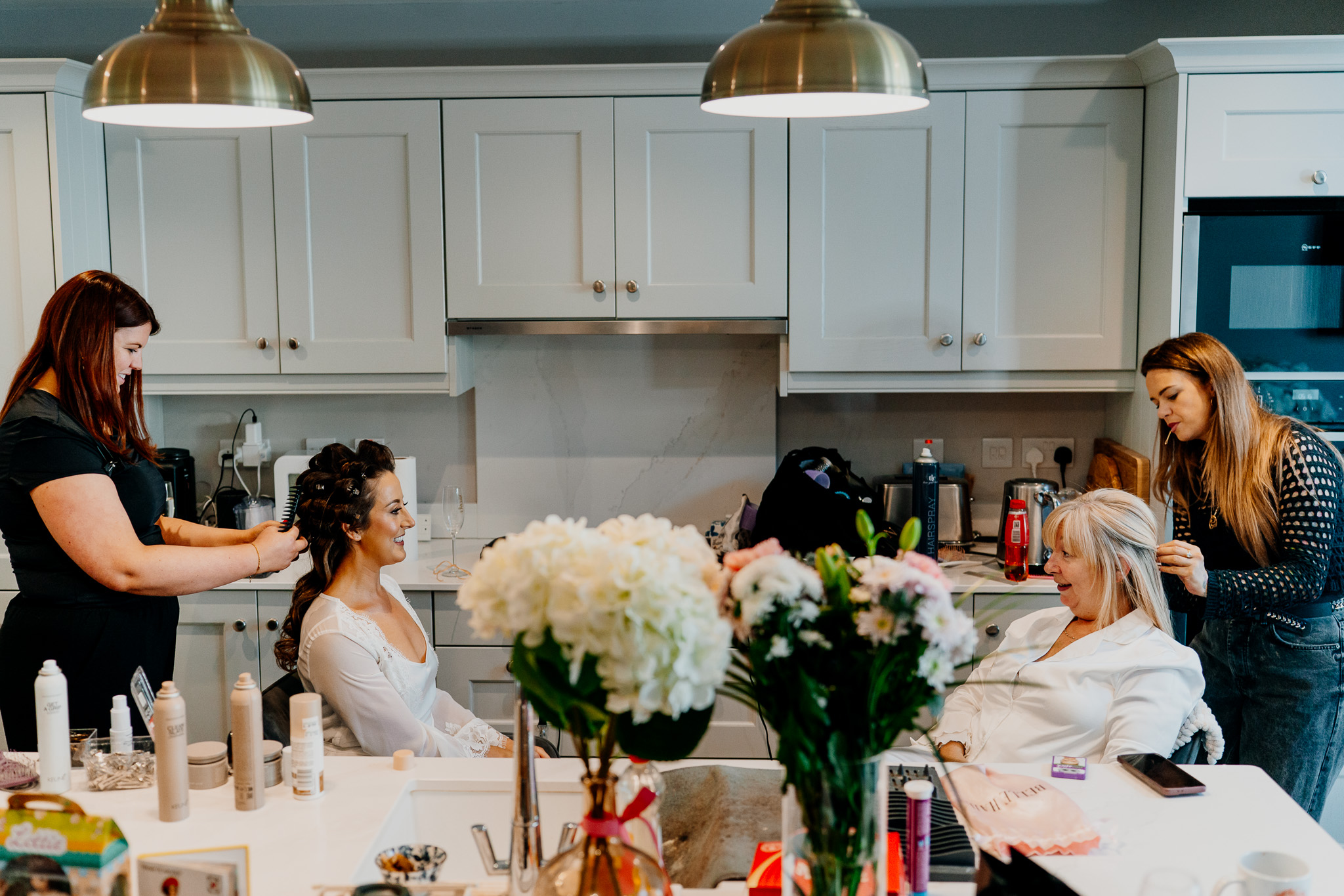 Family and friends gathered in the kitchen during wedding preparations in Sligo