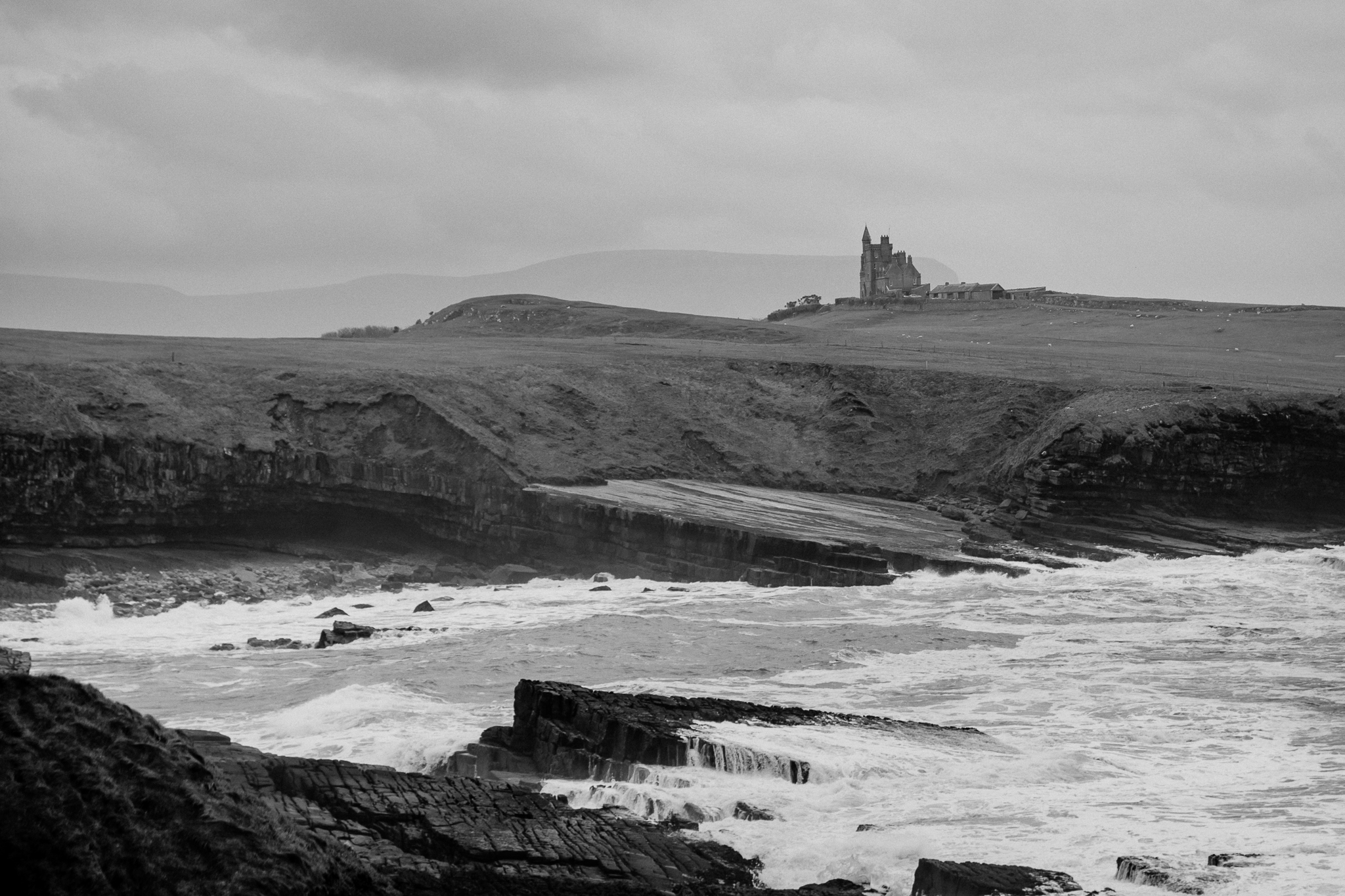 Black and white landscape of Classiebawn Castle above the rugged Mullaghmore coastline in Sligo