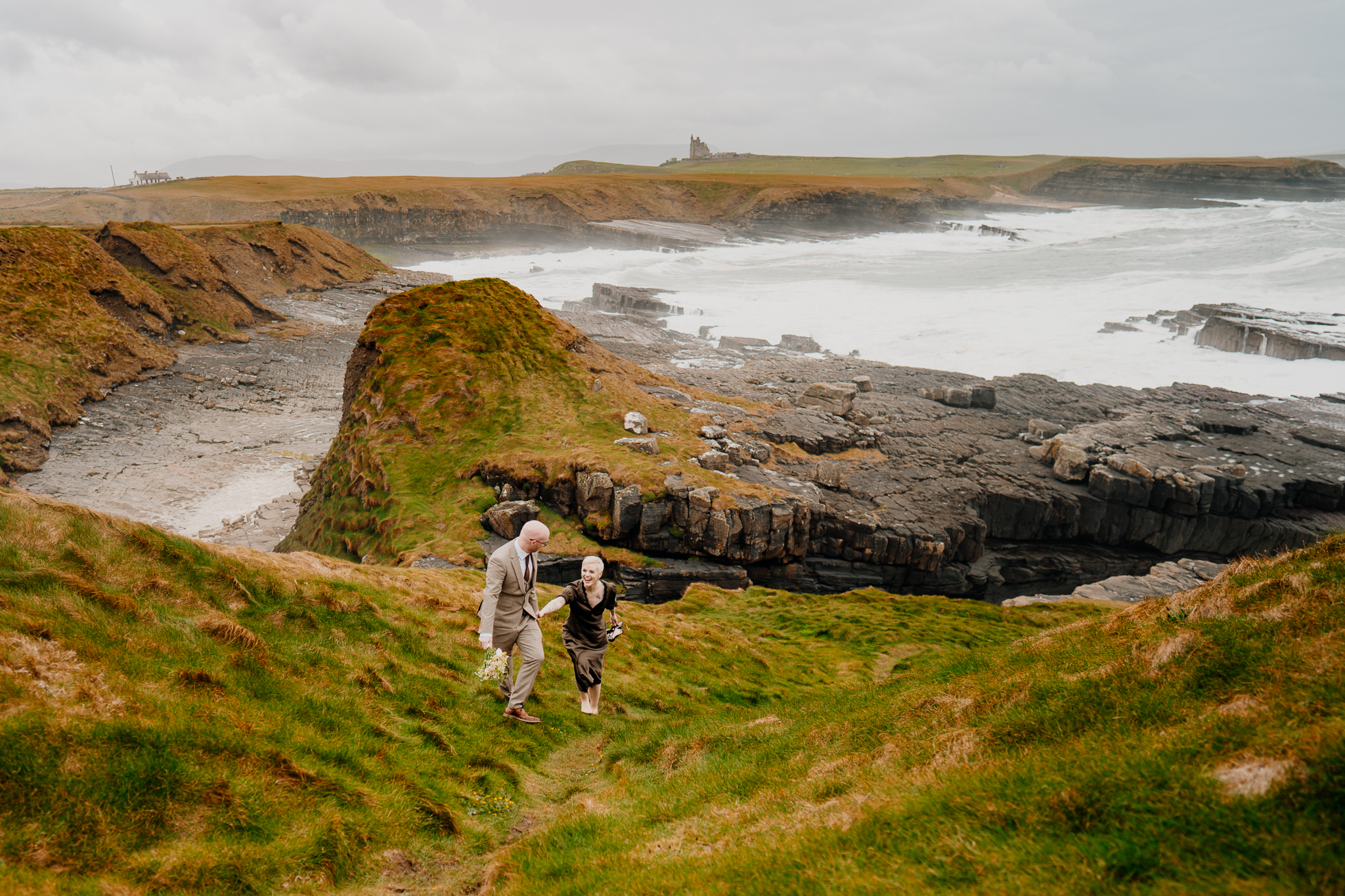 Wide view of the rocky Atlantic coastline and grassy cliffs at Mullaghmore Head in County Sligo