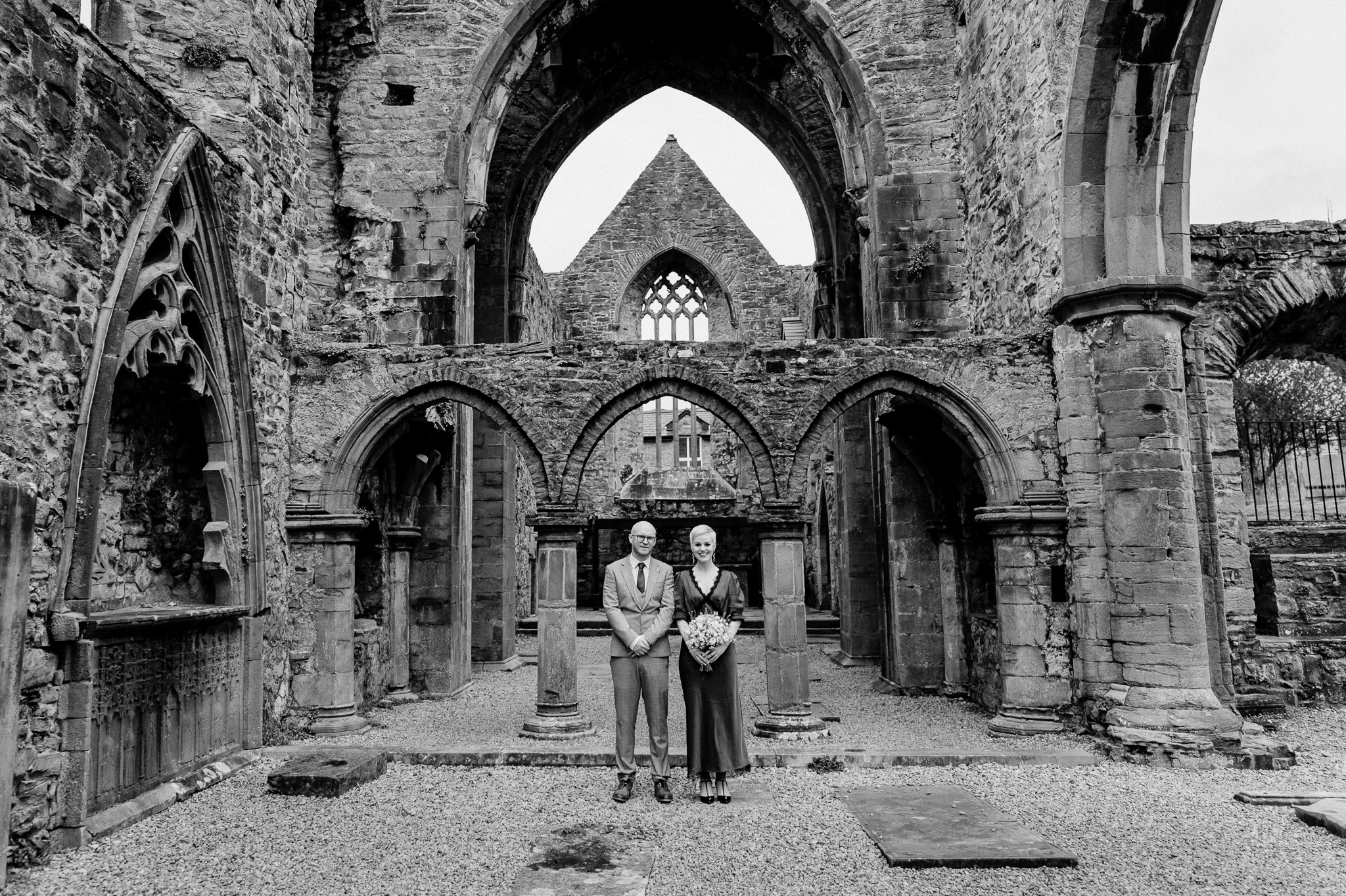 Sligo Abbey wedding photography with newlyweds framed by the historic stone arches