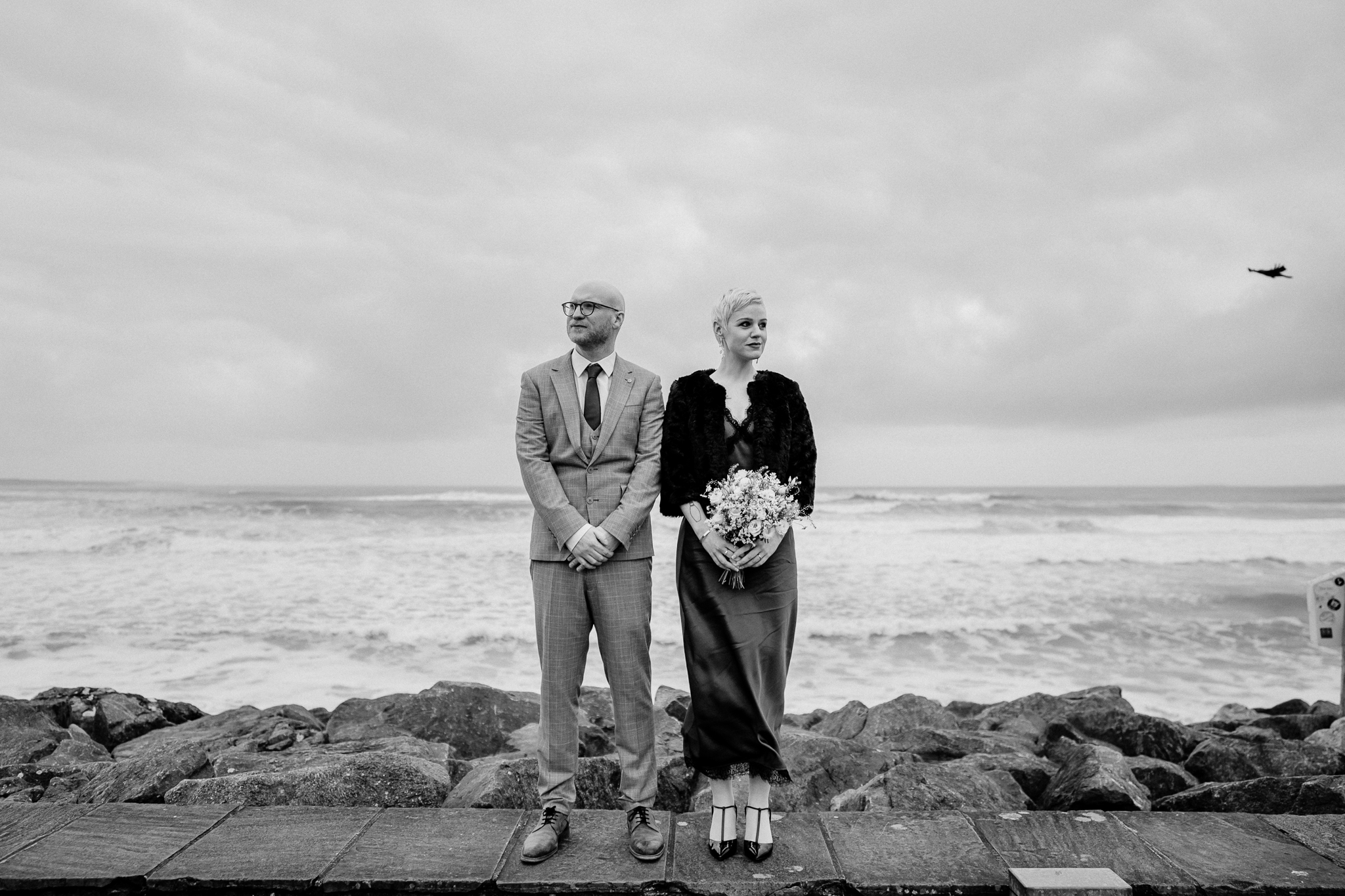 Black and white wedding portrait of newlyweds on Strandhill seafront in County Sligo