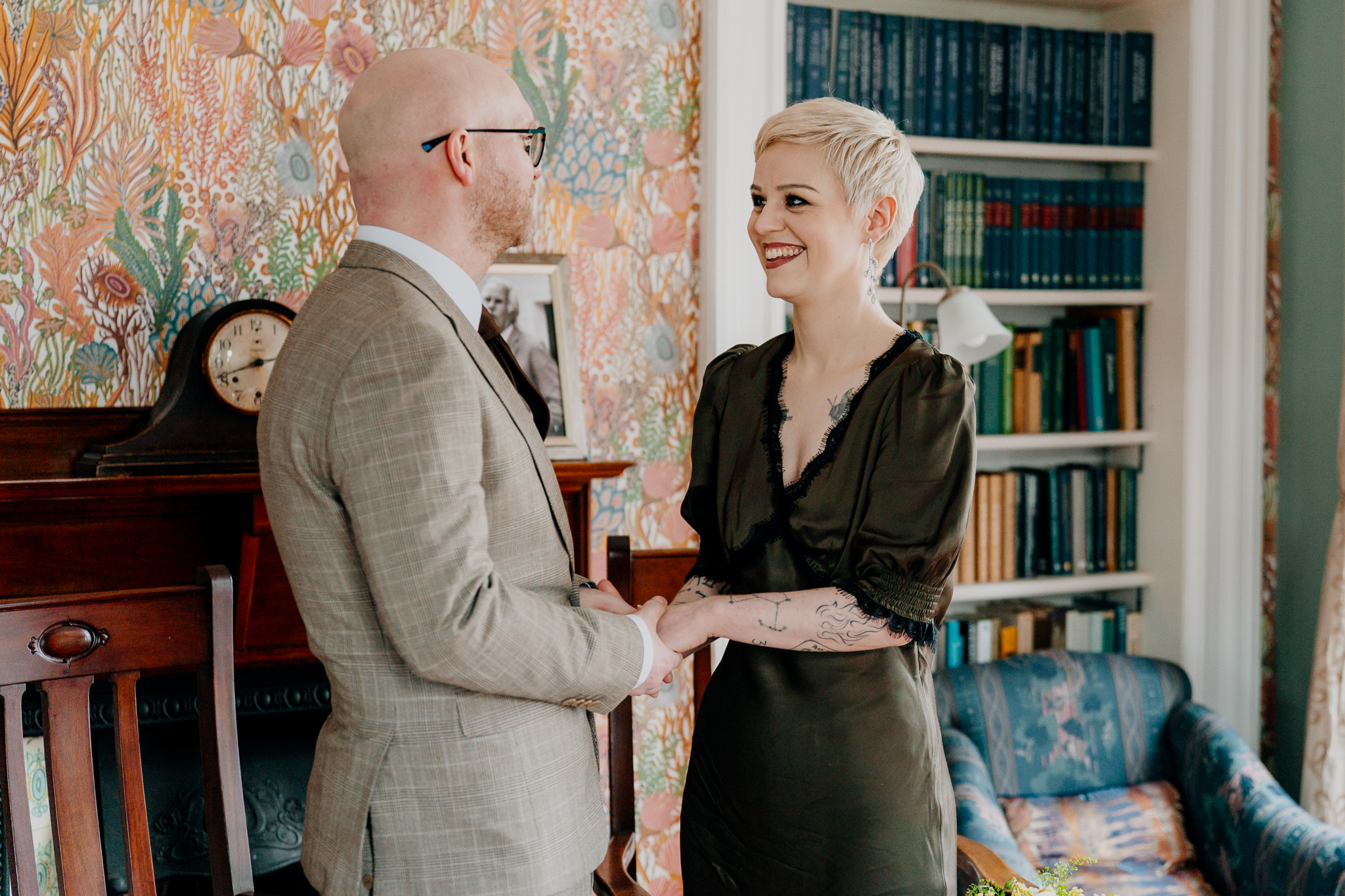 Intimate wedding couple standing together in Crichton Library at the Yeats Building
