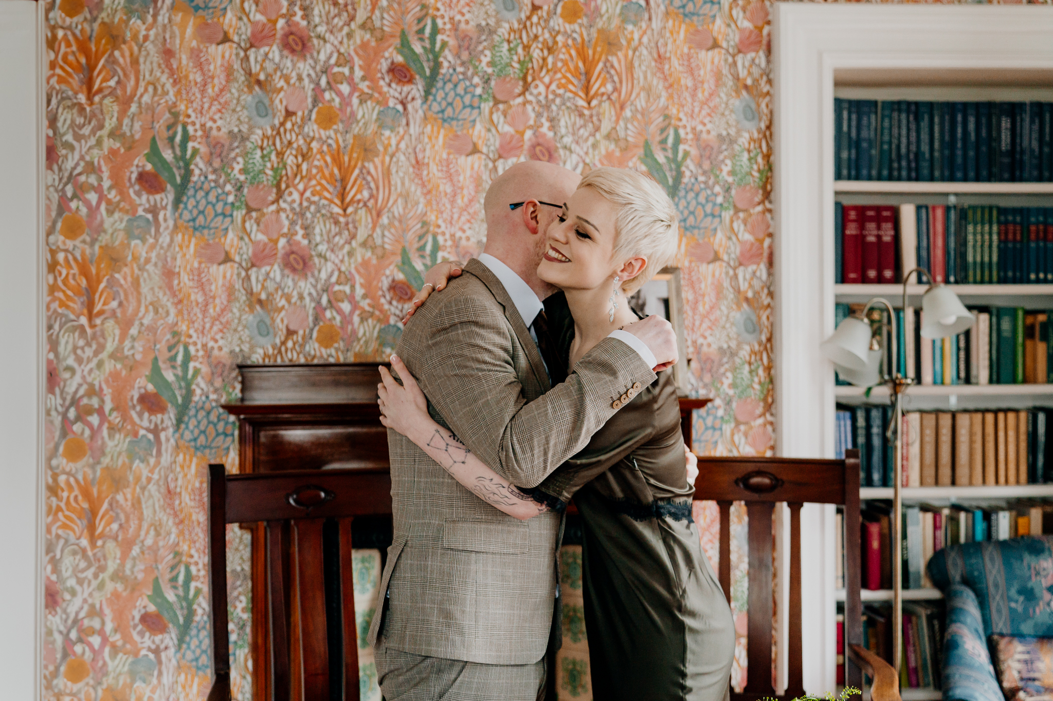 Newly married couple embracing in a historic room at Yeats Society Sligo