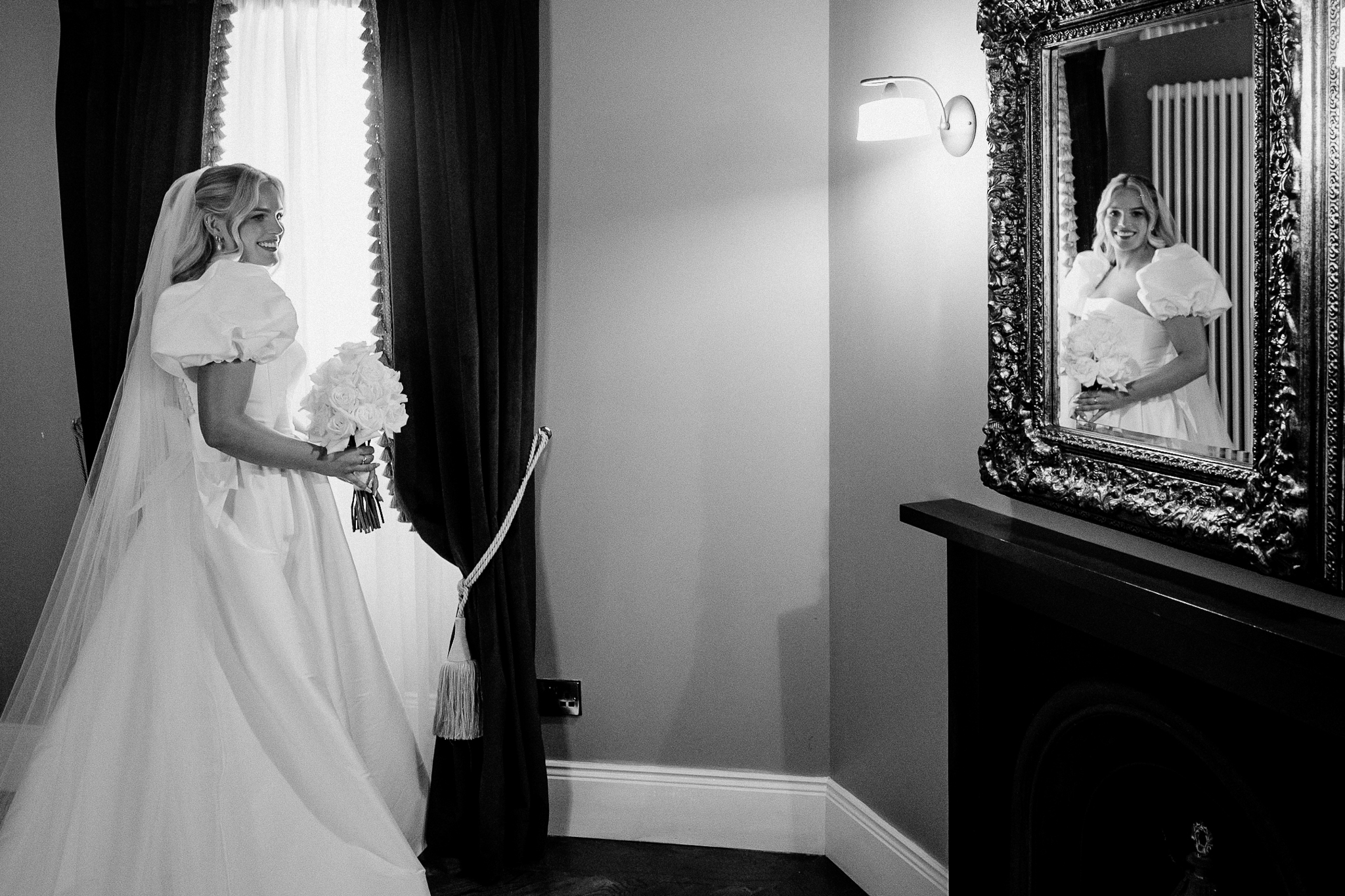 Bride Caoimhe by the window in the Bridal Suite at Markree Castle