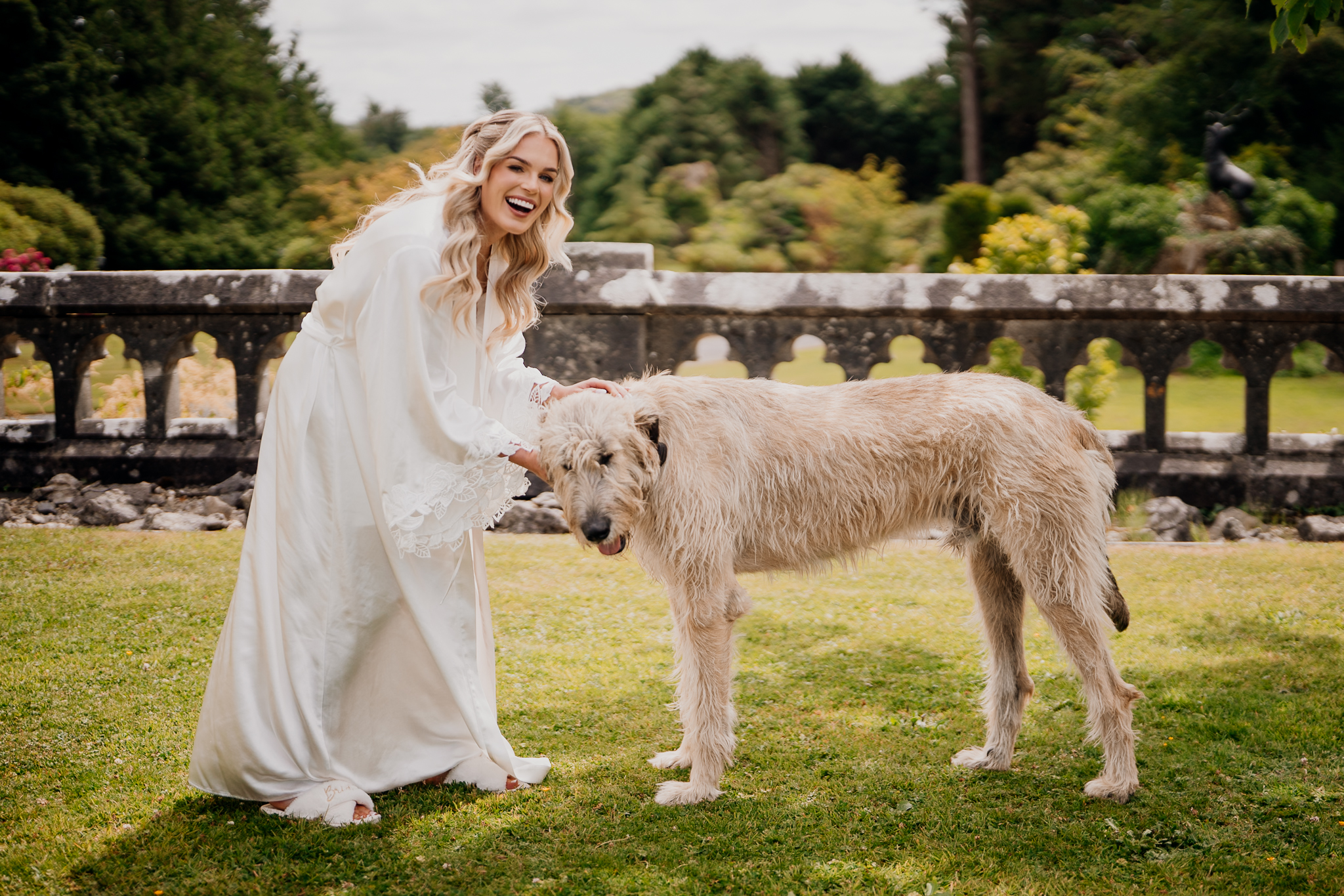 Bride with her dog in the gardens at Markree Castle wedding venue