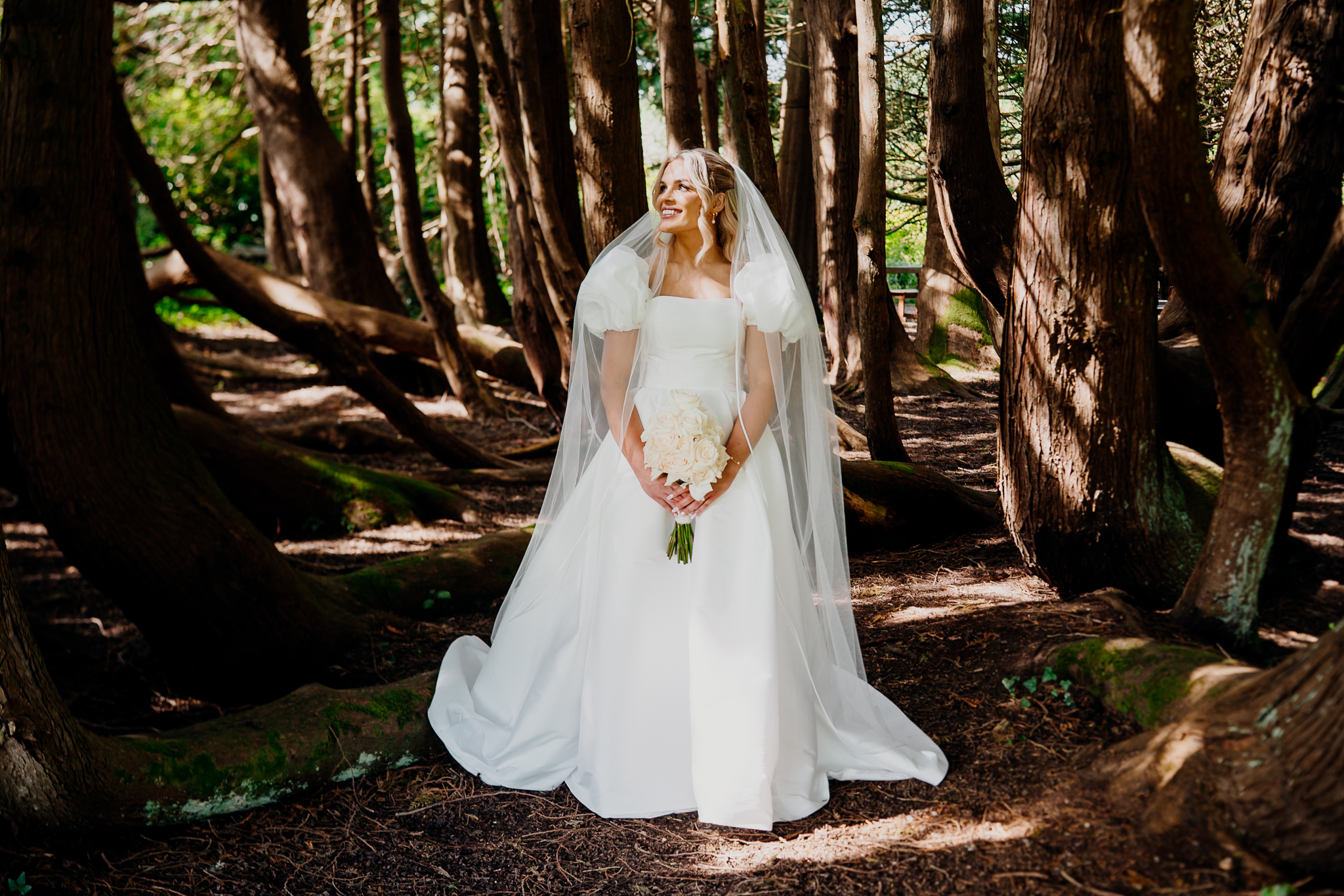 Bride Caoimhe photographed among the trees in the grounds of Markree Castle