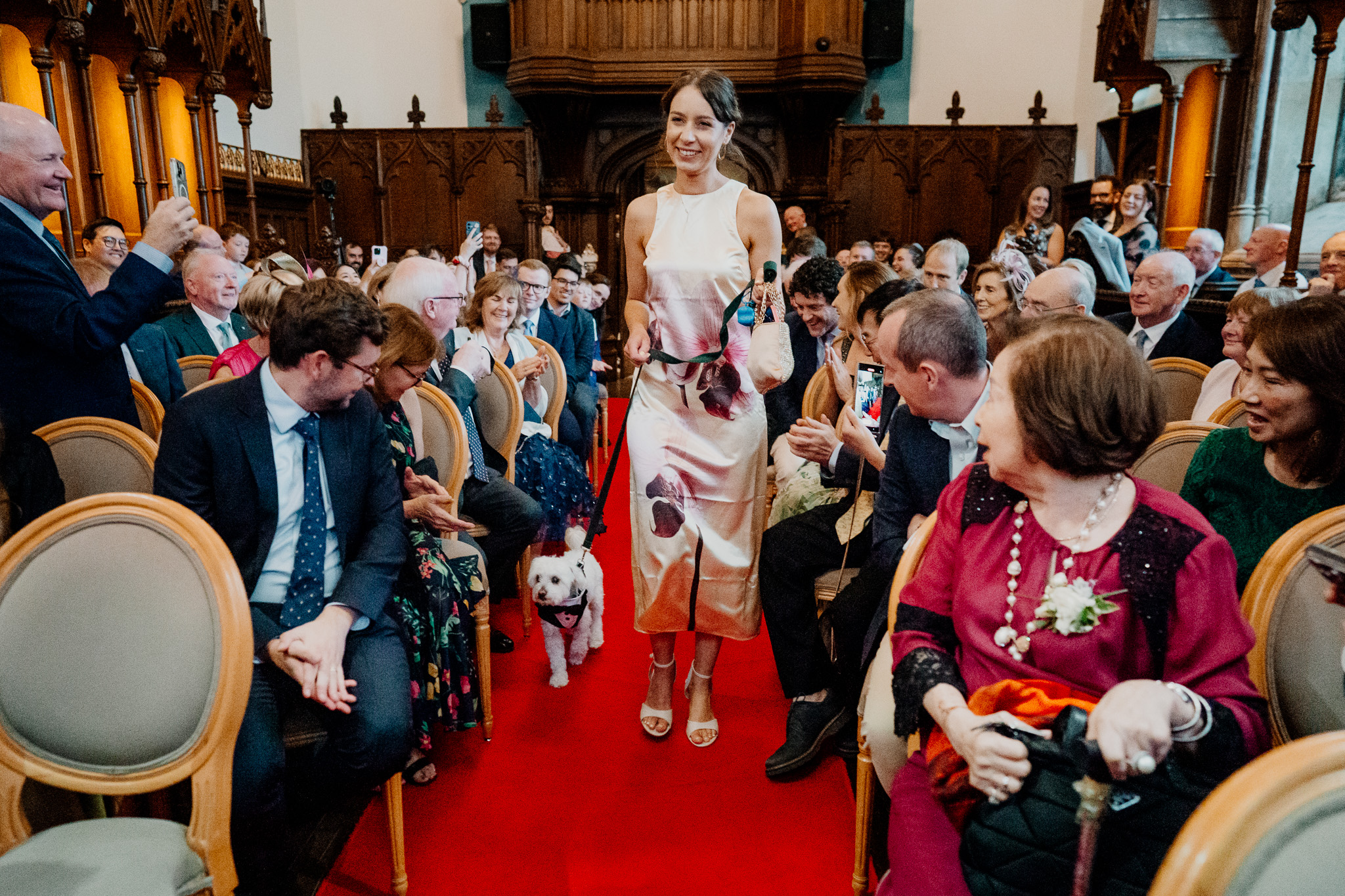 Bride walking down the aisle in Markree Castle Chapel