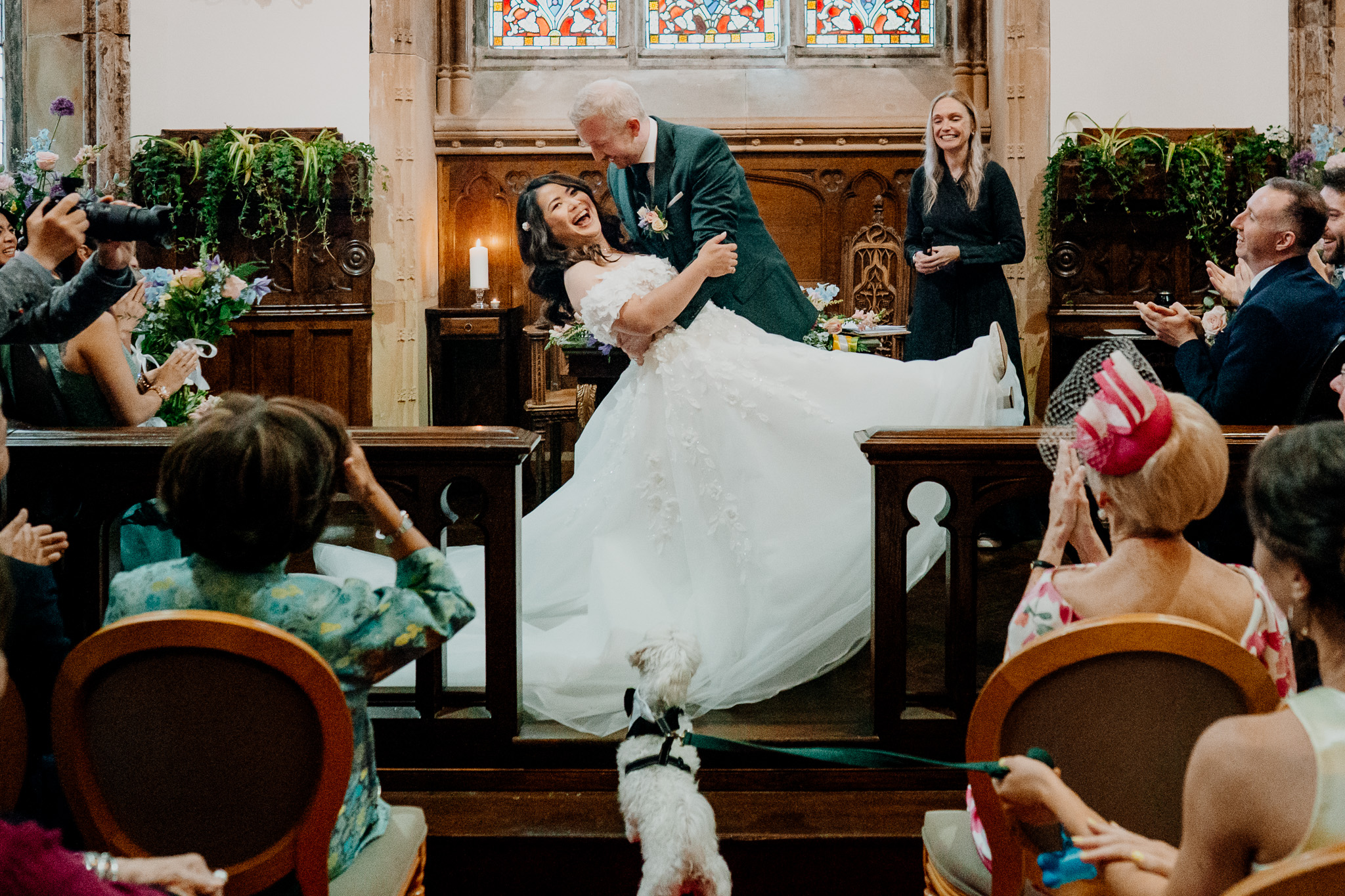 Bride and groom kissing at the altar in Markree Castle Chapel